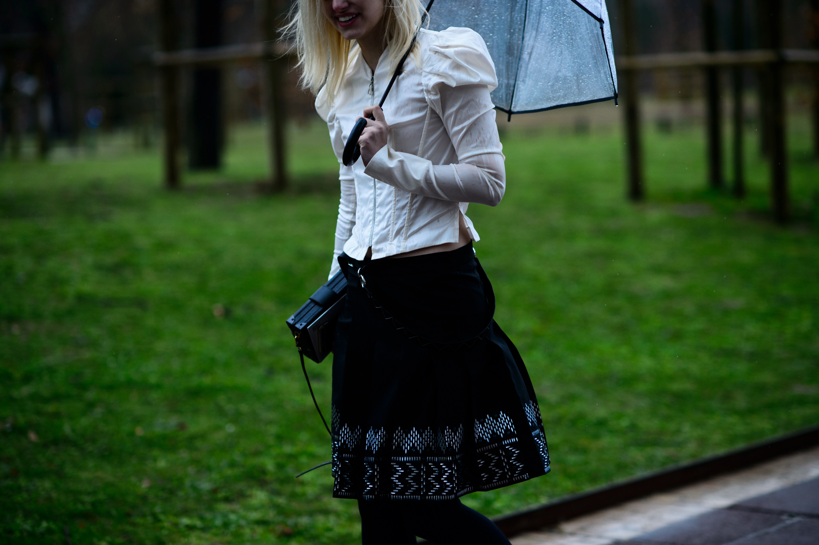 Woman in white shirt with translucent umbrella