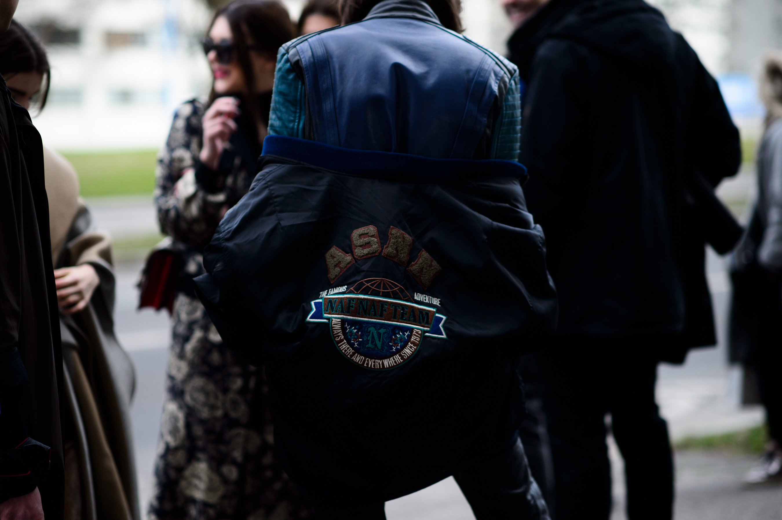 Man wearing jacket with logo
