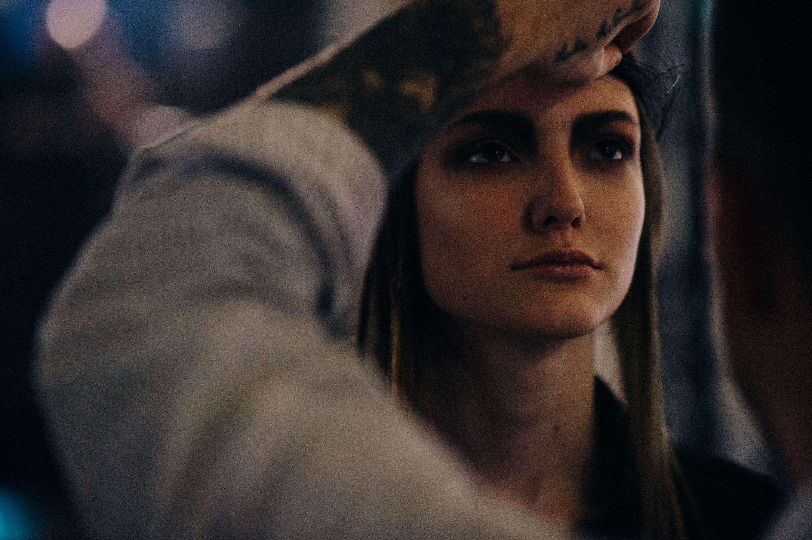 Model having her hair fixed backstage