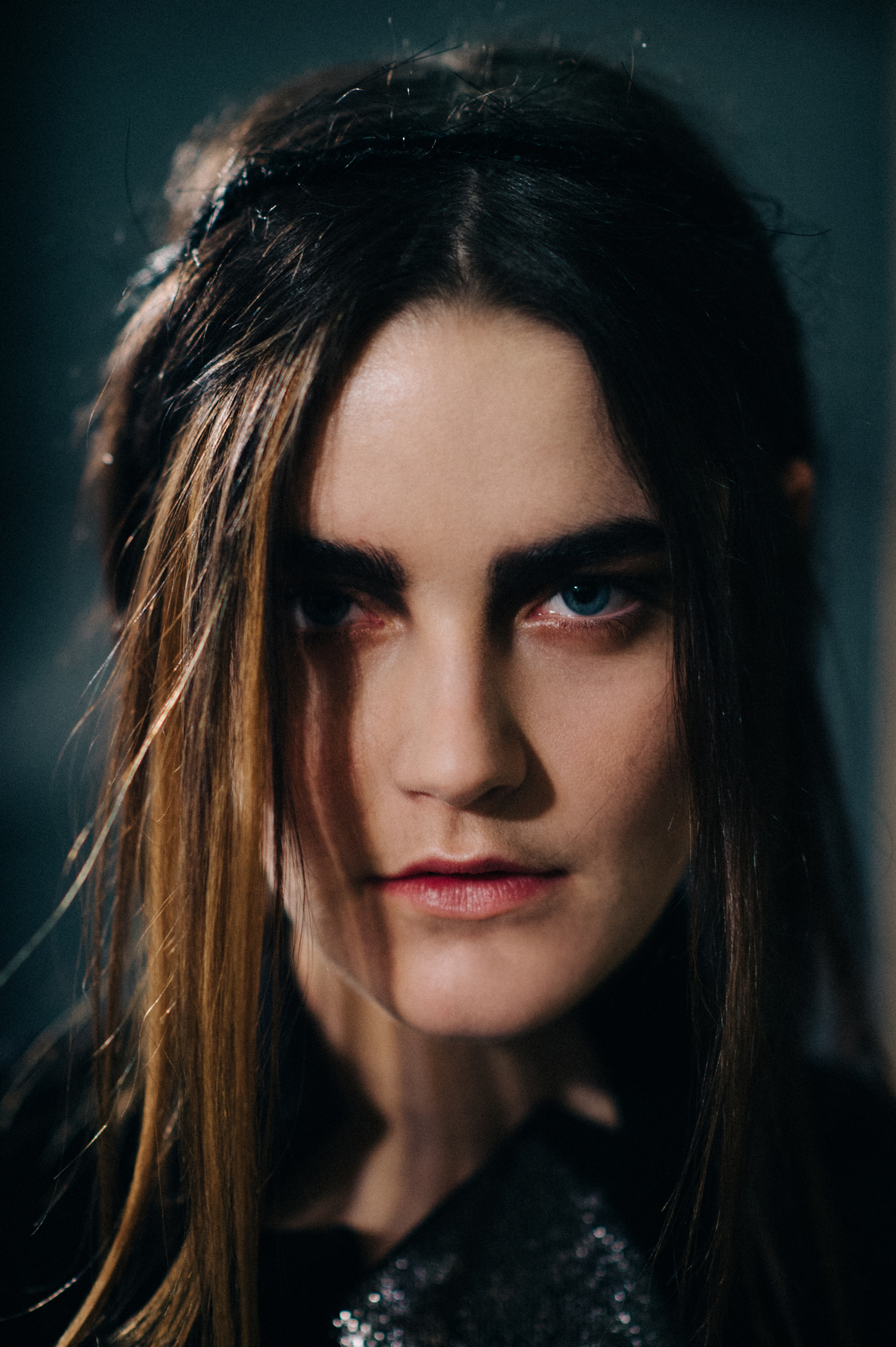 Portrait of model with centre parting and shadowed face