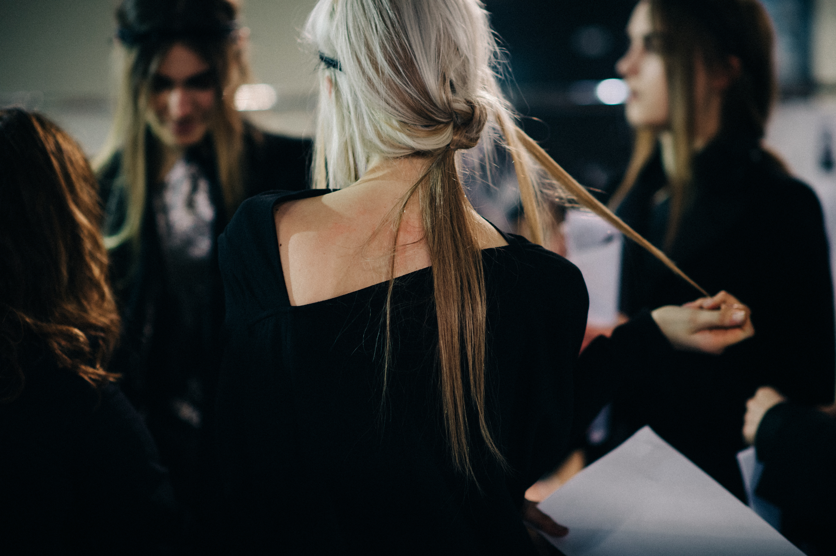 Model playing with blonde hair