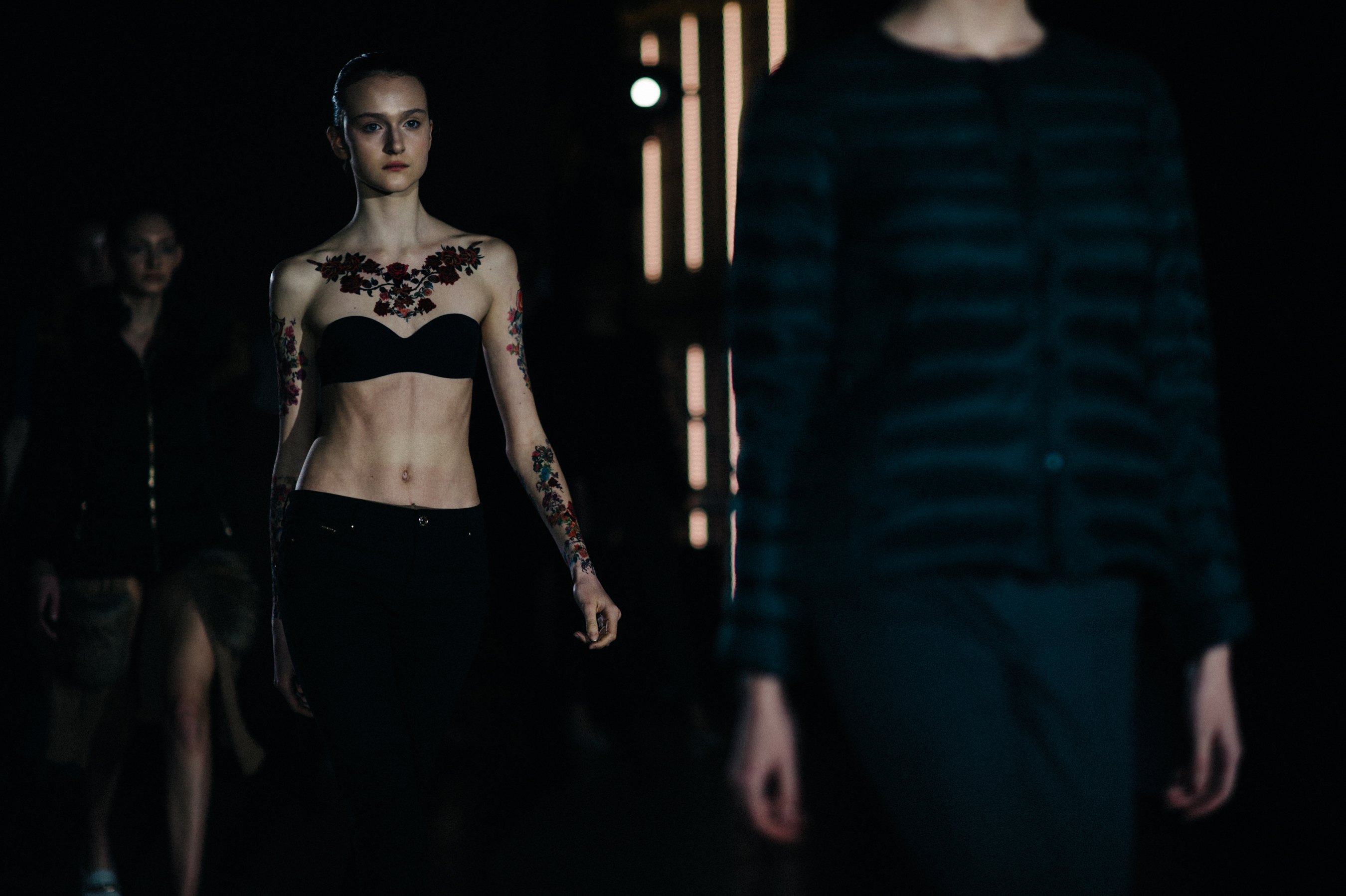 Model with fake tattoos on runway