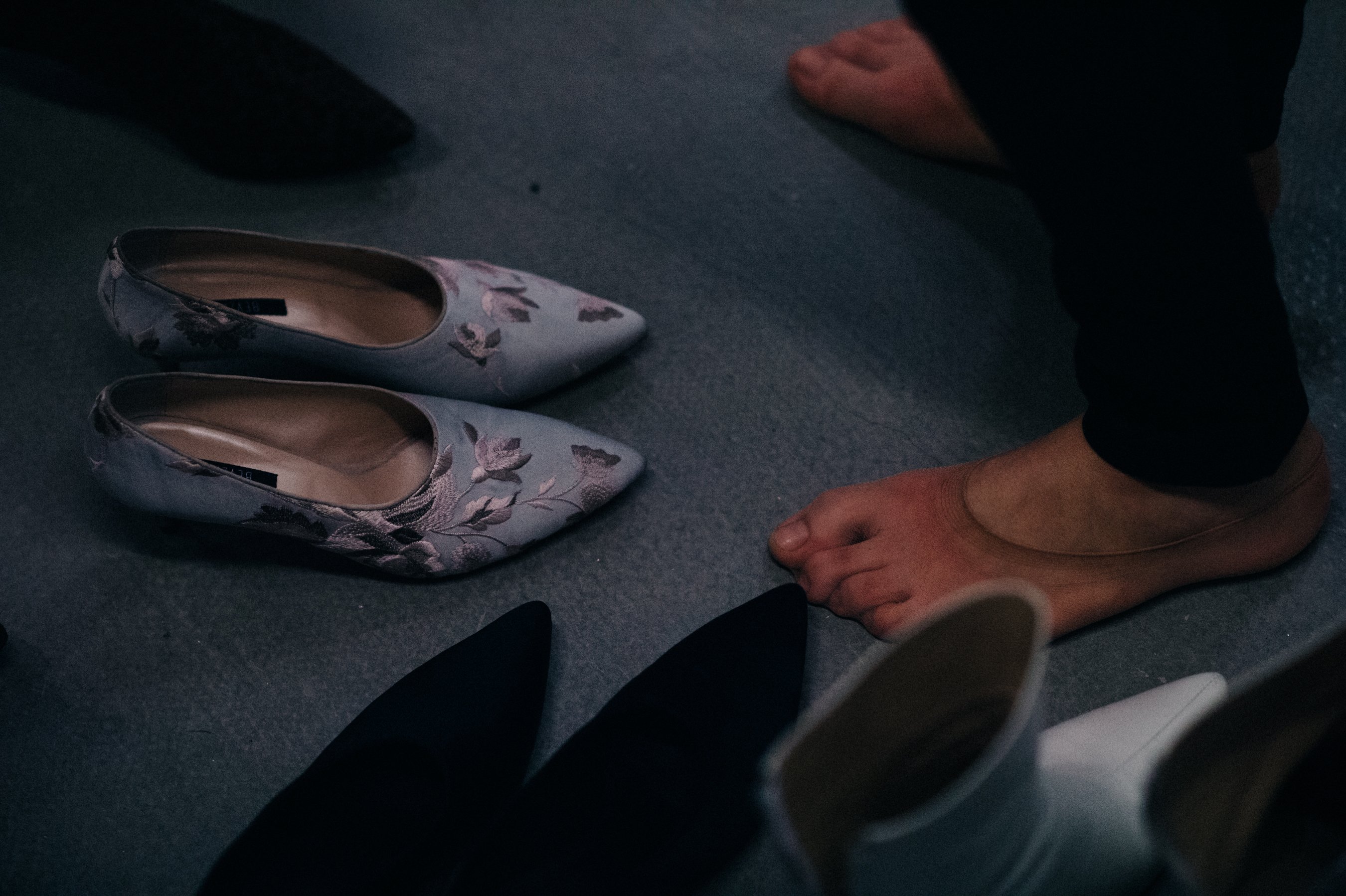 Close up of floral embroidered shoes