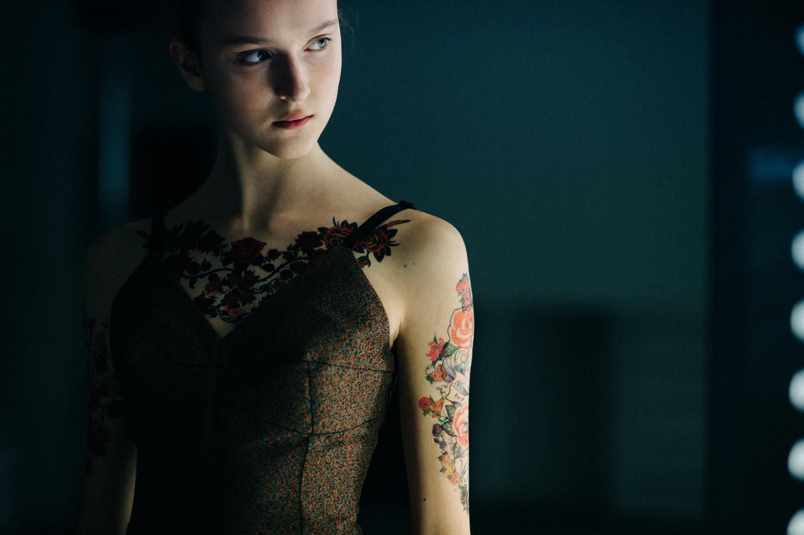 Model with fake tattoos before the show
