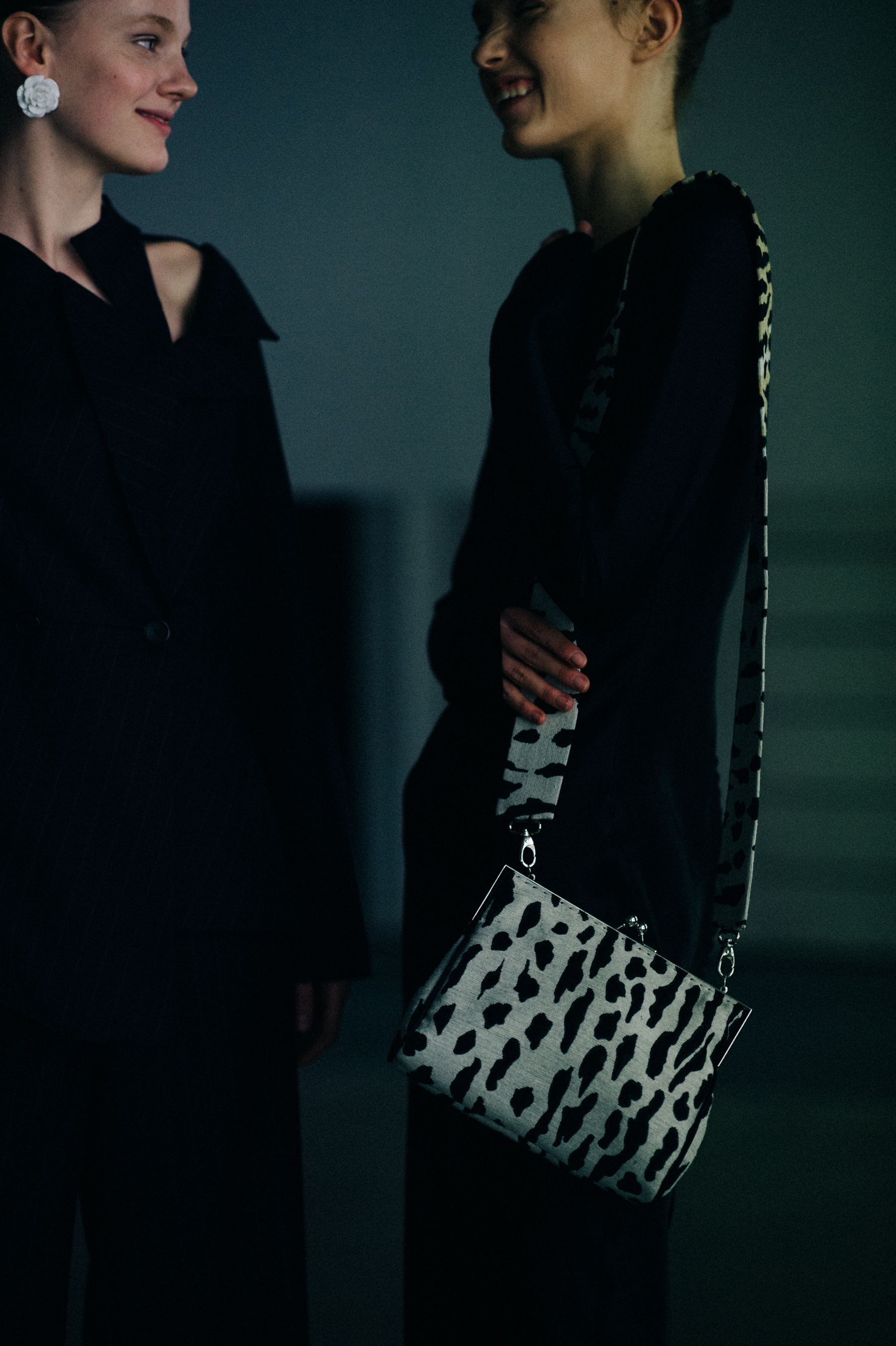 Two models laughing before the show
