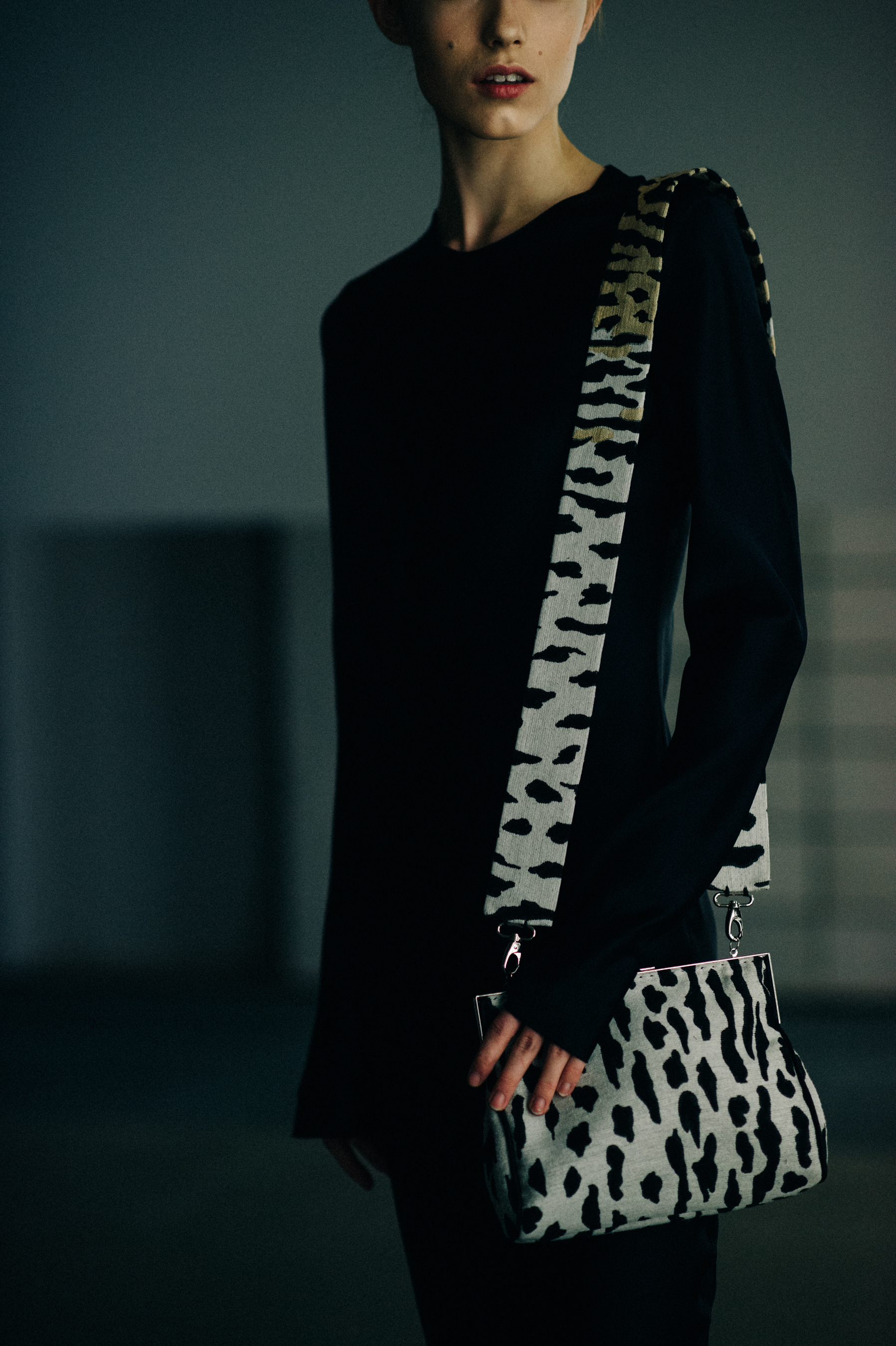 Model with black and white bag