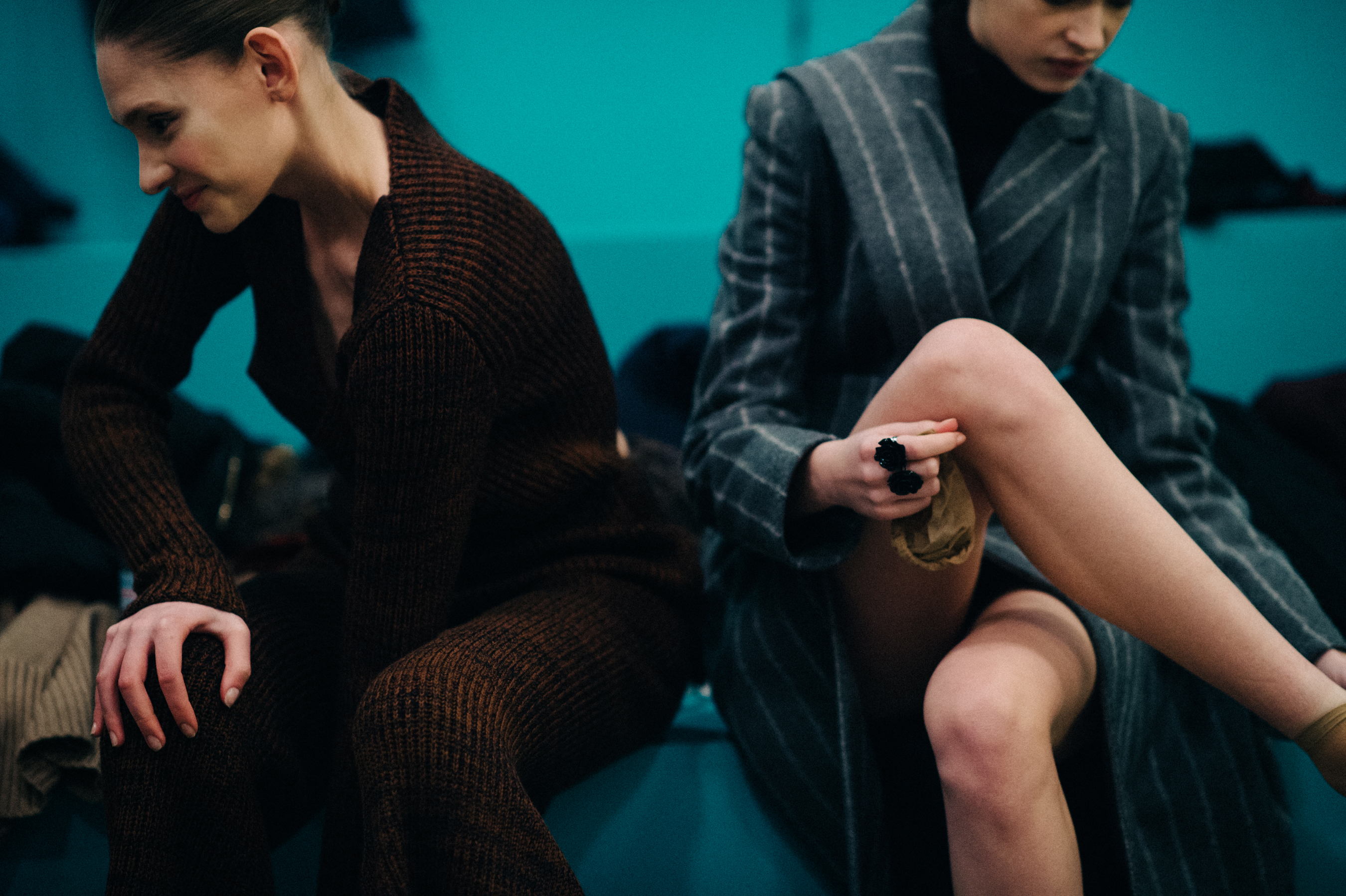 Two models getting dressed