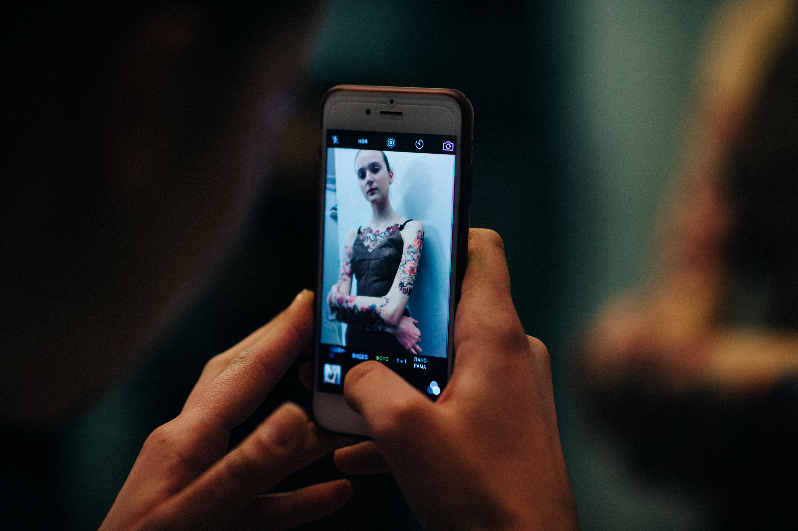 Stylist taking photo of a model