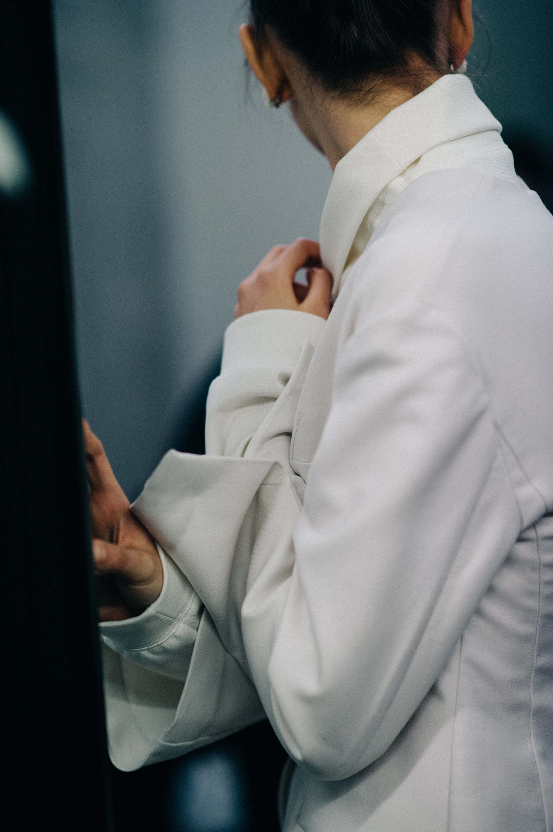 Model wearing white shirt and blazer