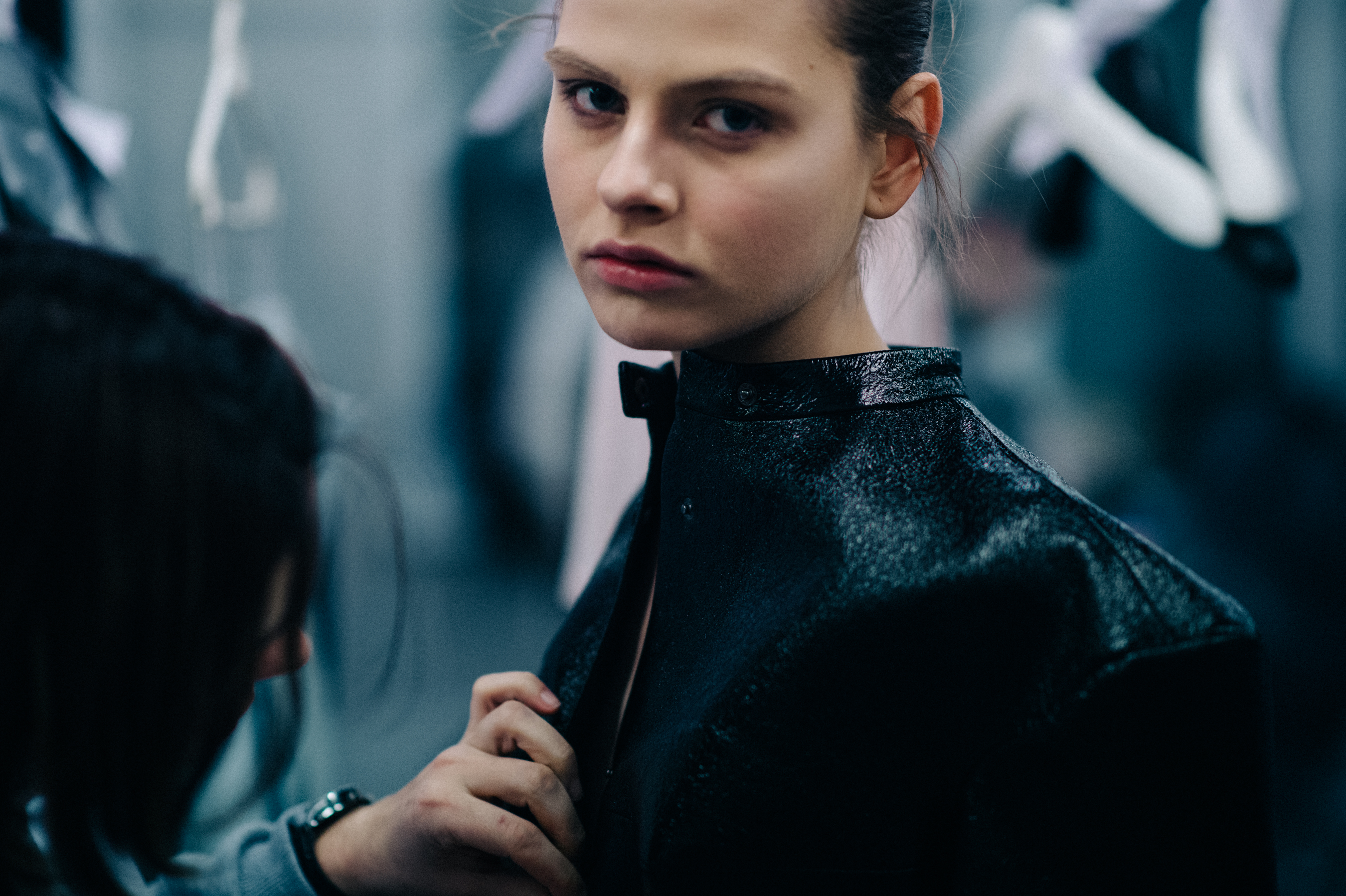 Model wearing shiny black leather