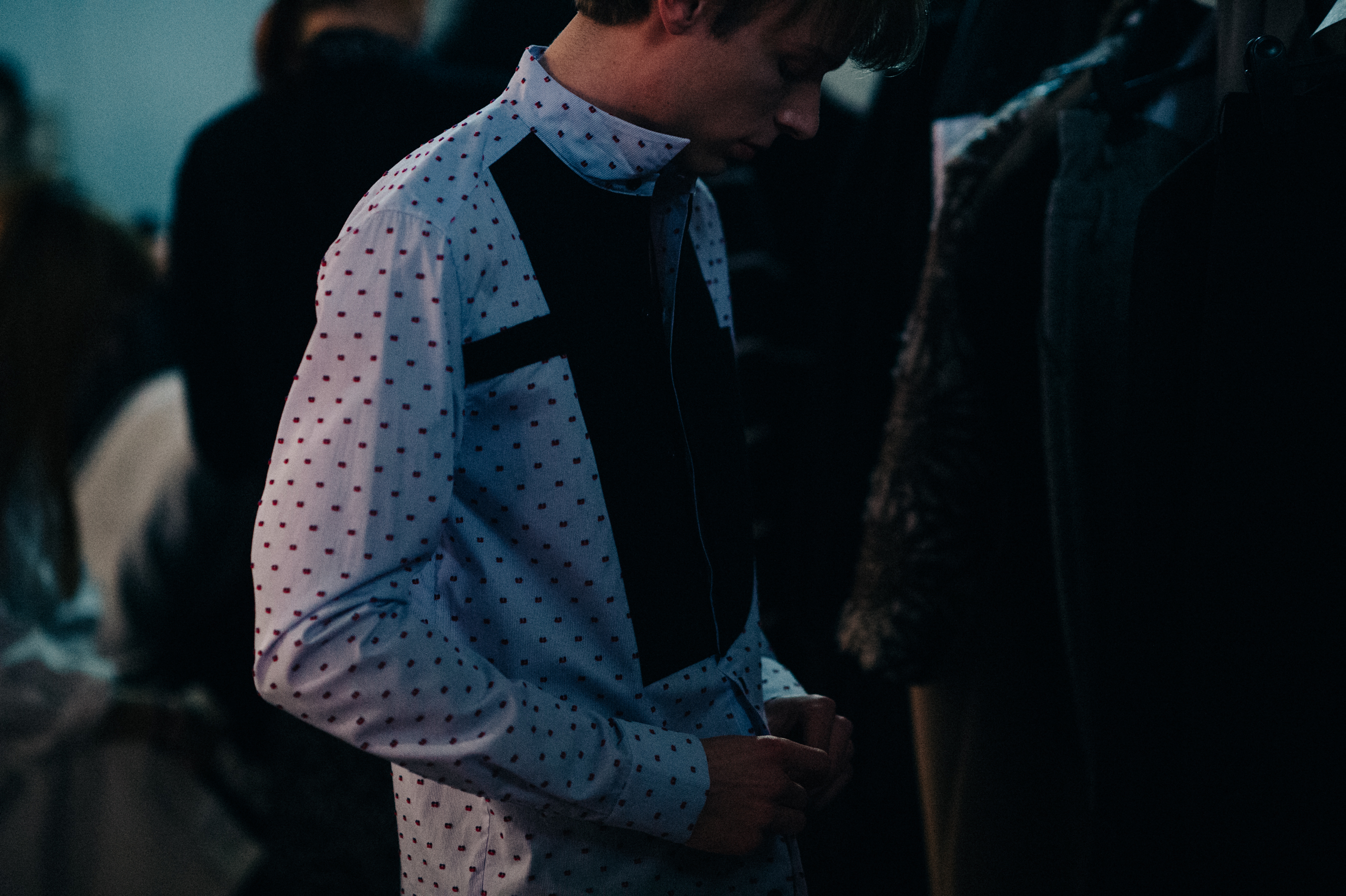 Male model wearing white dotted shirt