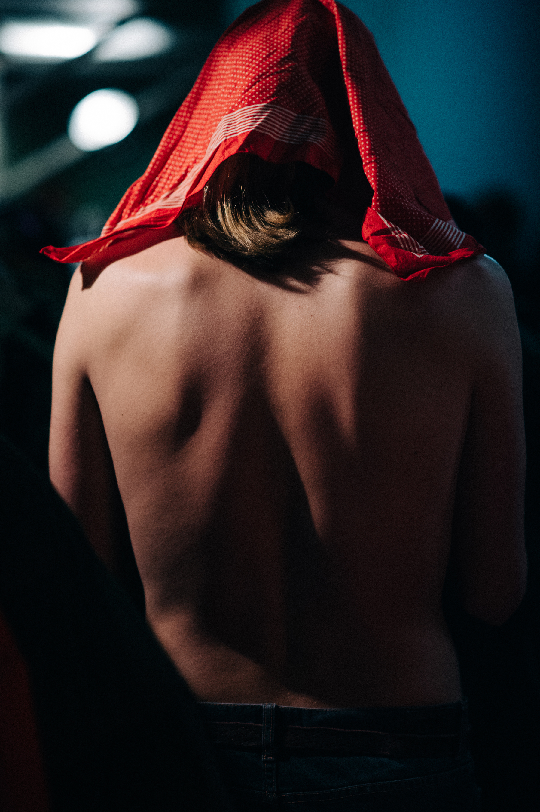 Shirtless male model getting dressed