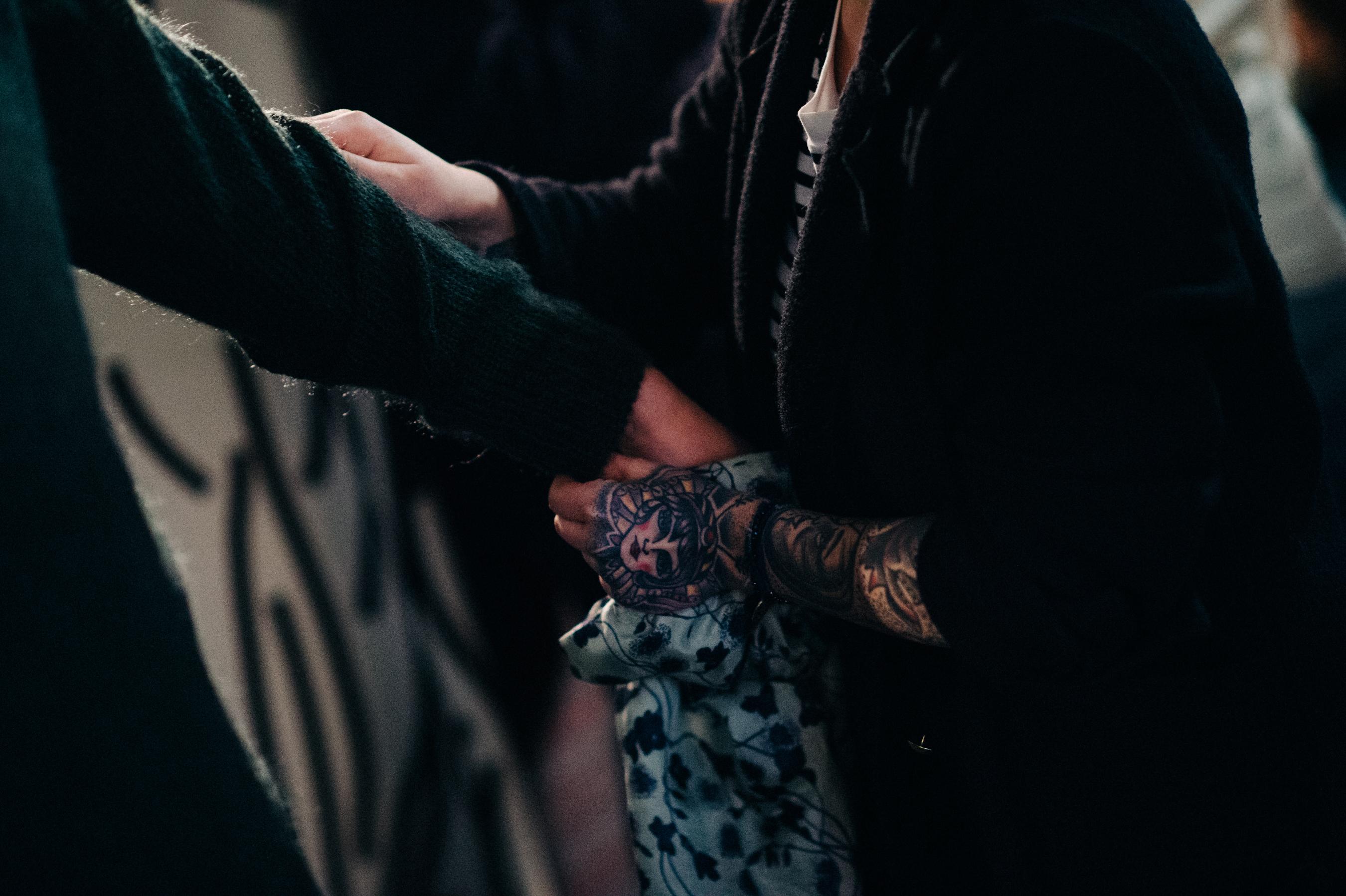 Dresser with tattooed hands