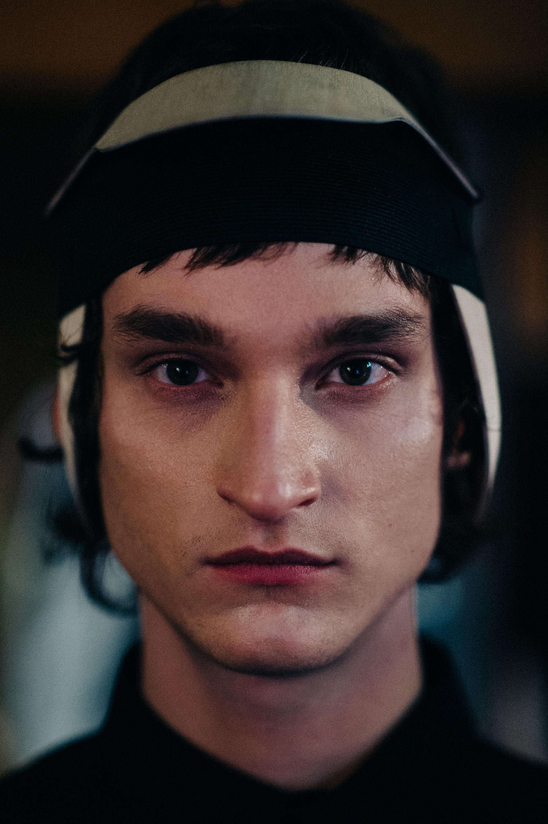 Portrait of a male model wearing headpiece