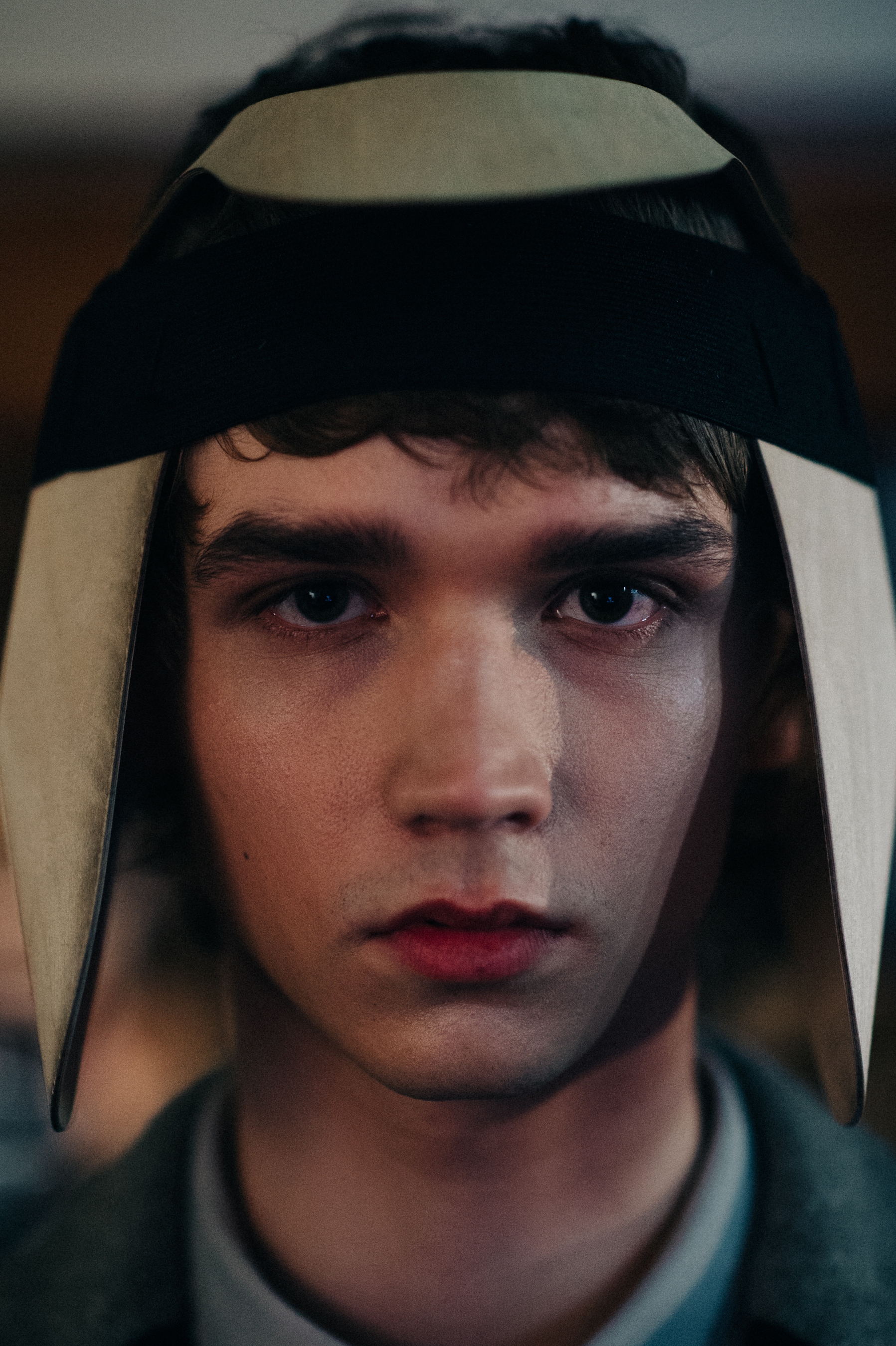 Portrait of male model wooden headpiece