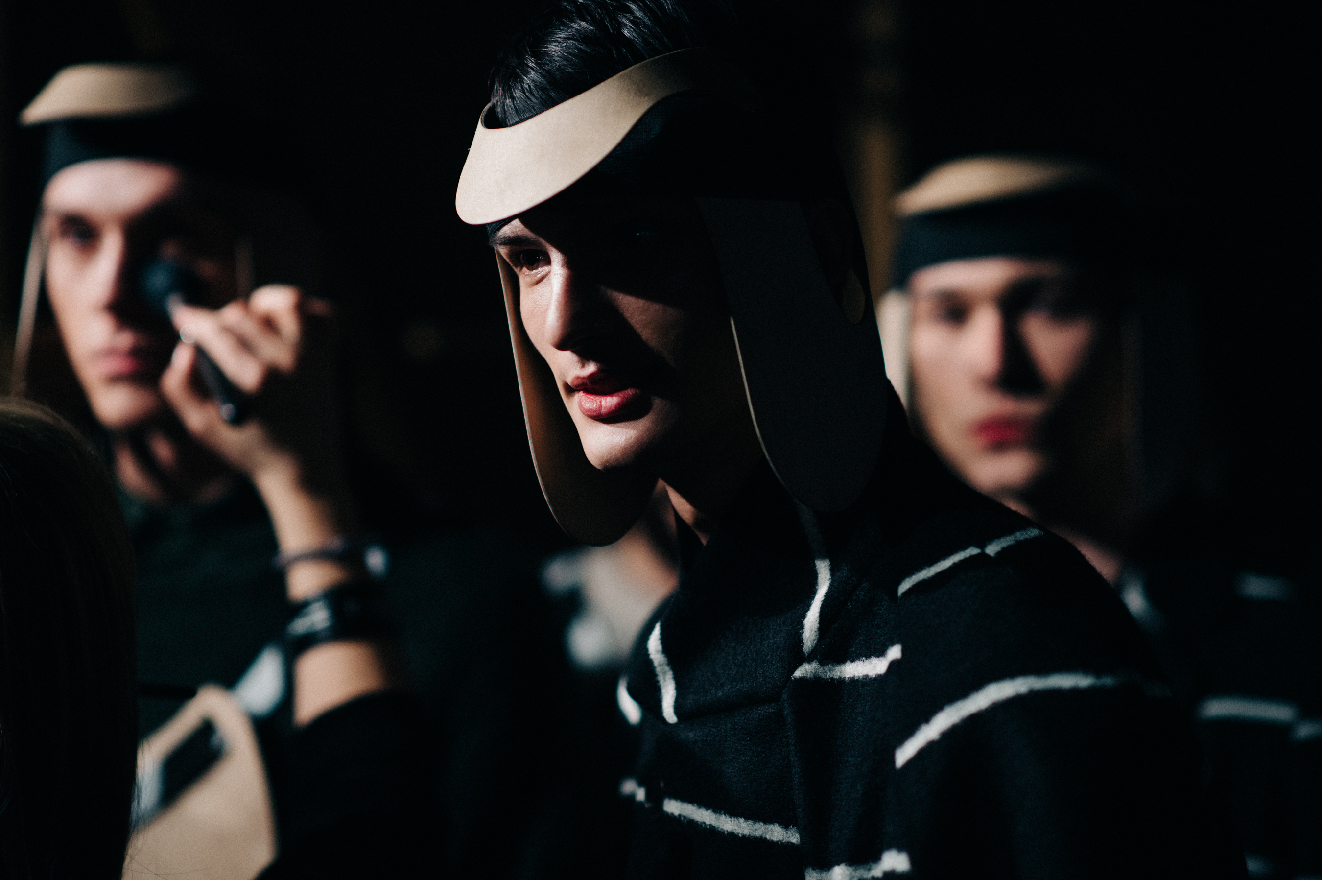 Male models with wooden head pieces