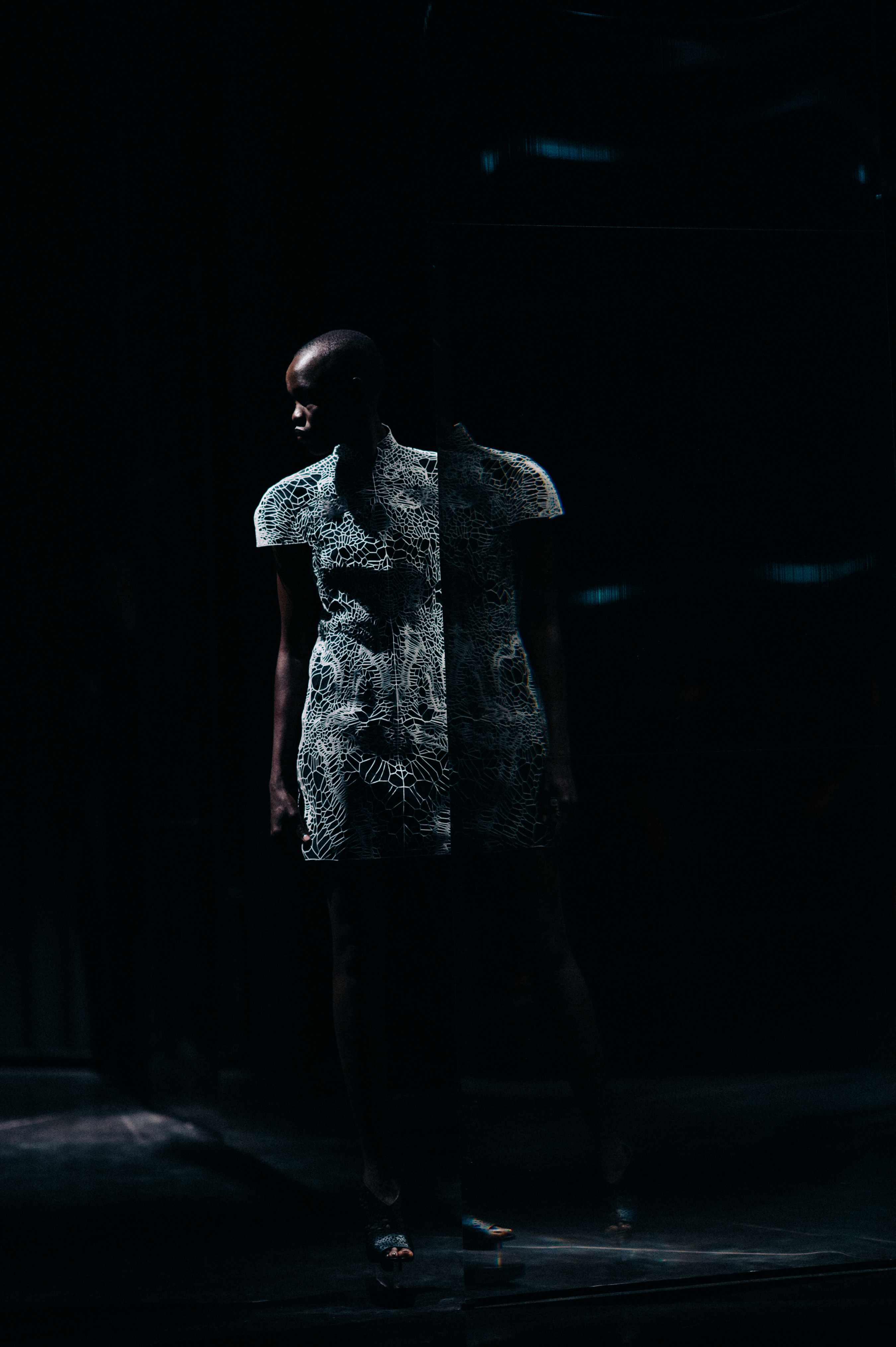 Sudanese model wearing white futuristic dress