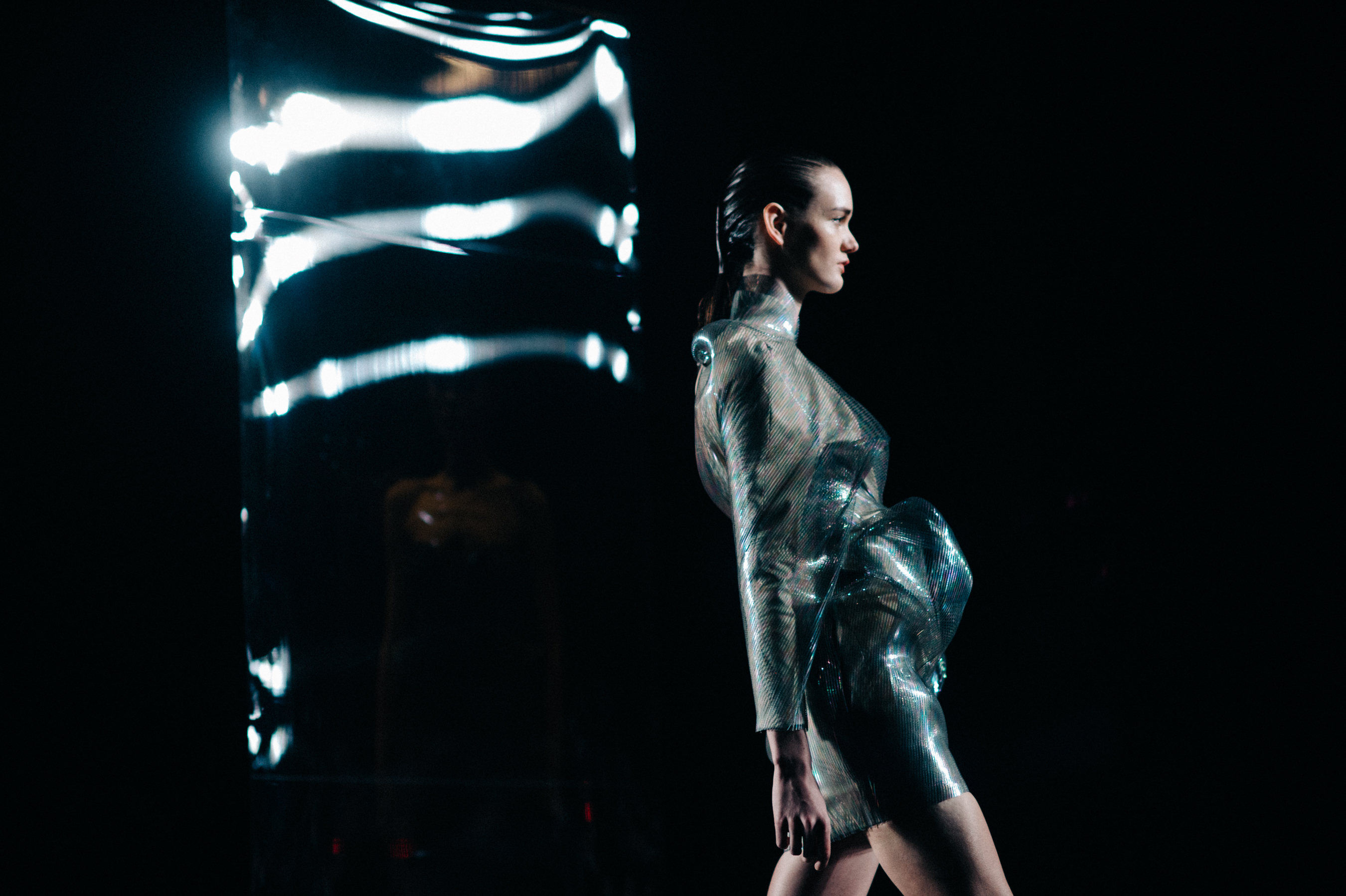 Model wearing complicated shaped dress