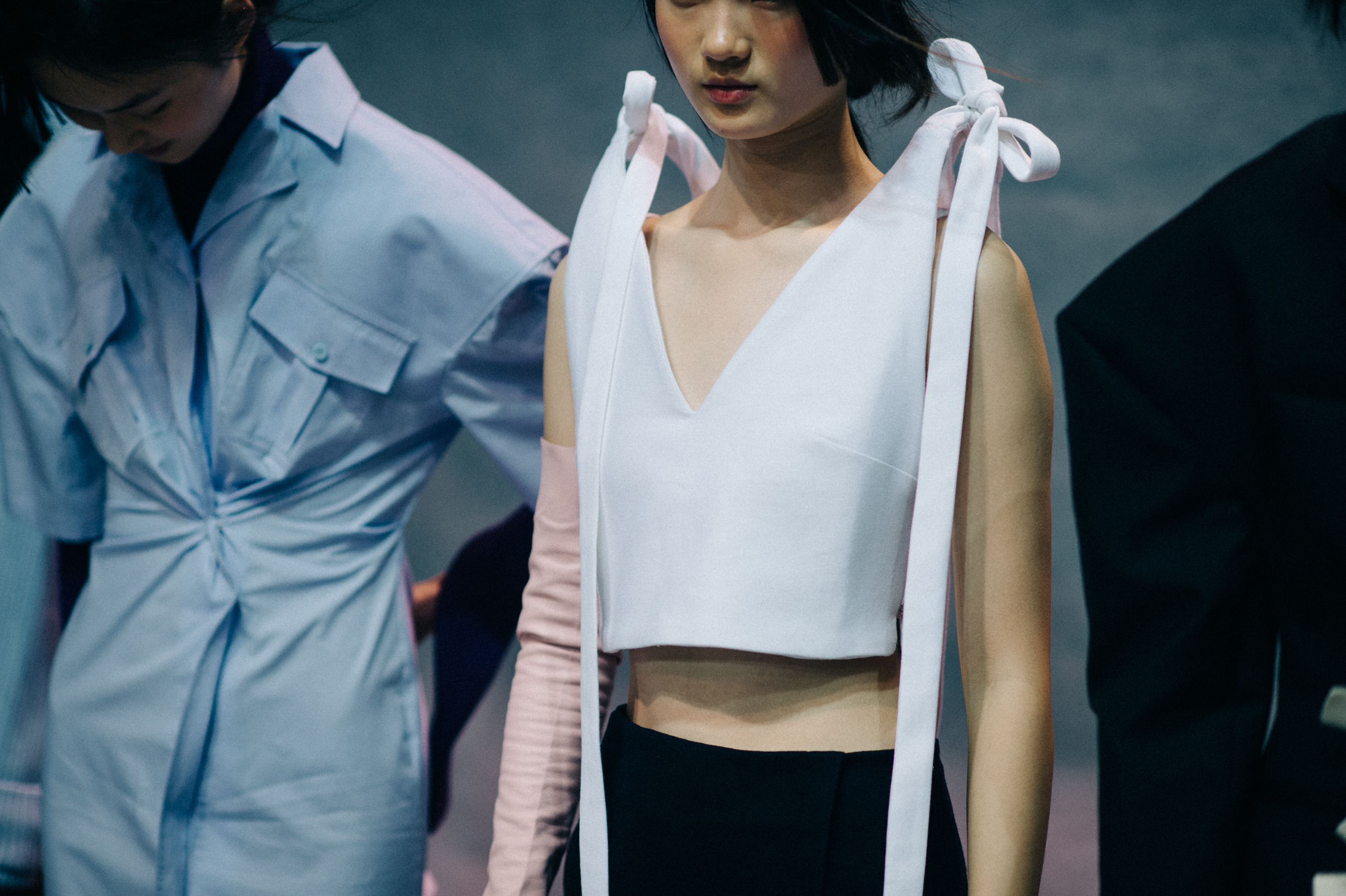 Two Asian models backstage