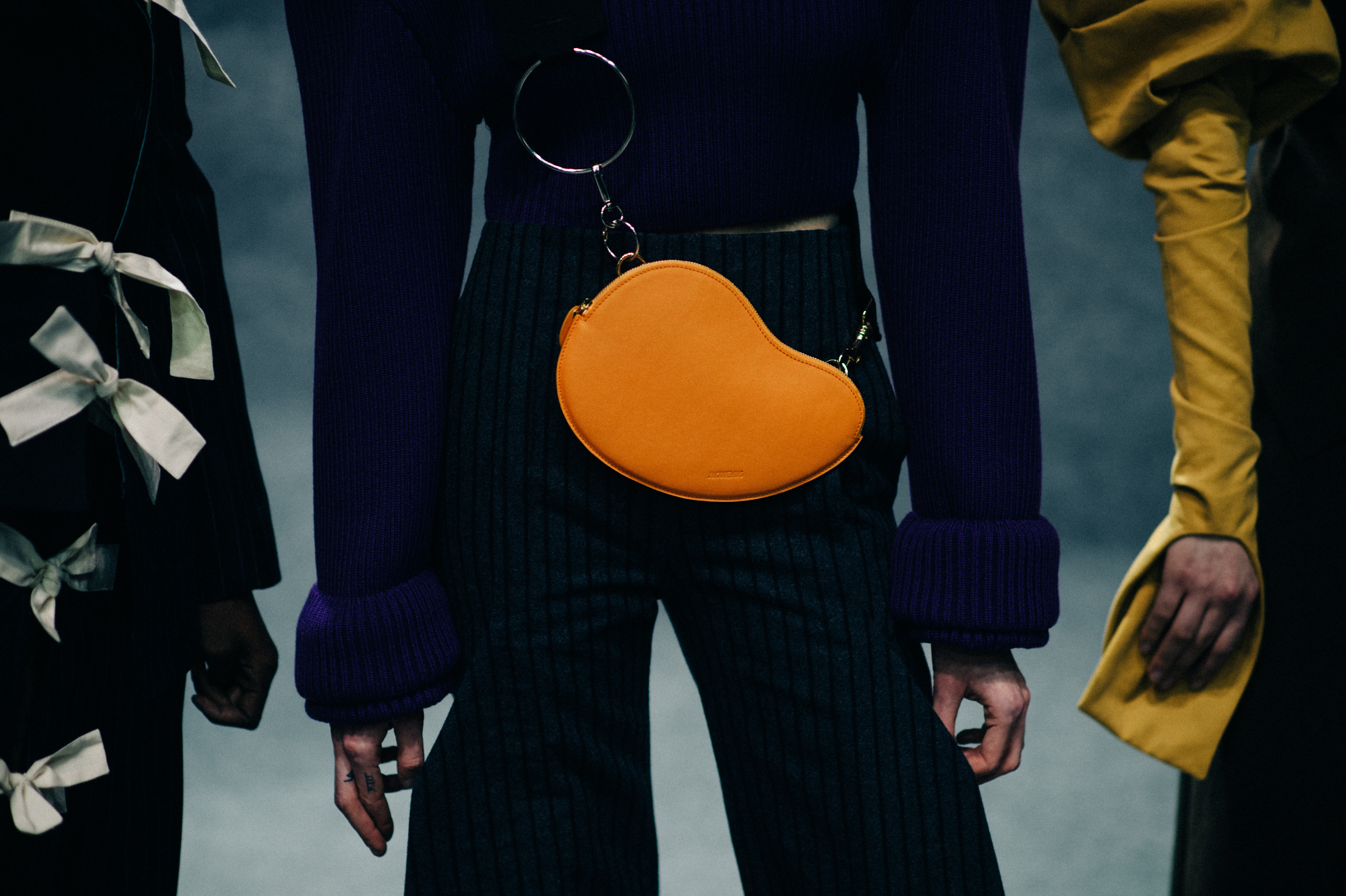 Close up of orange bag on model