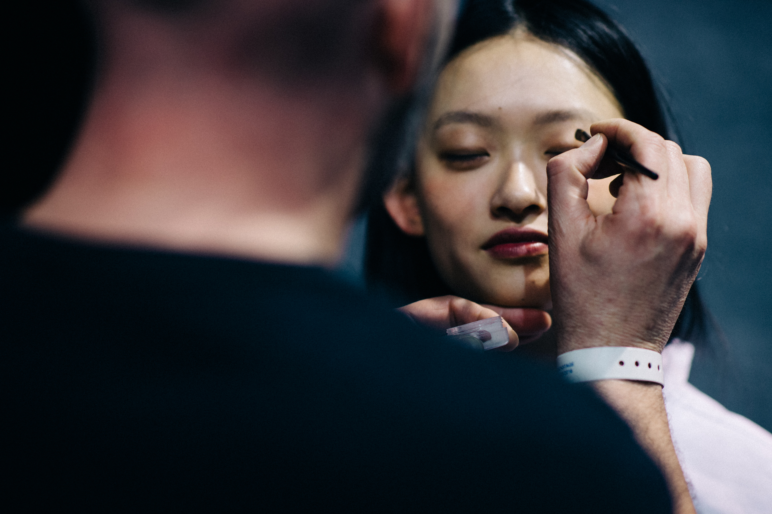 Asian model having makeup applied