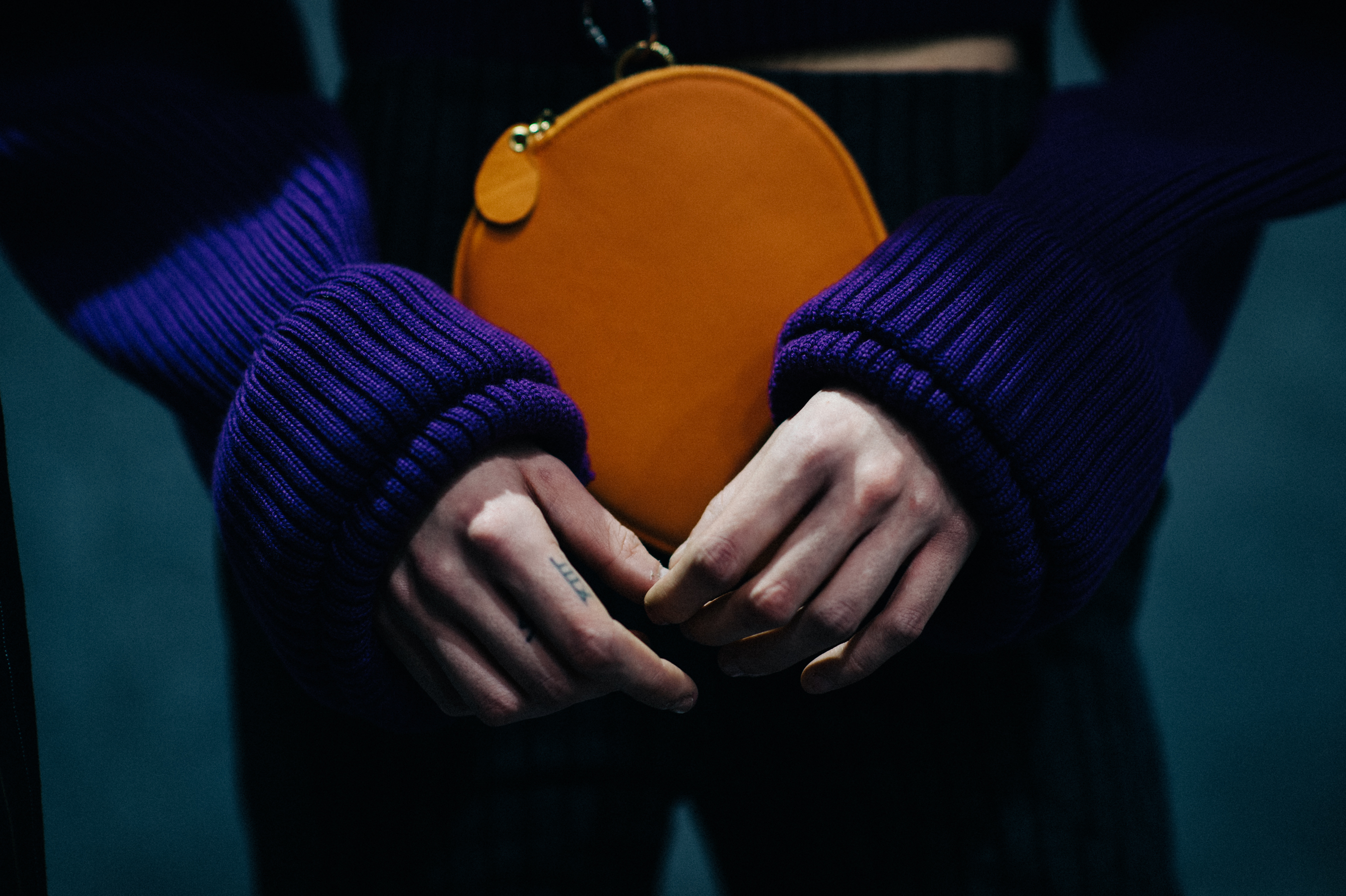 Close up of models hands with tattoo