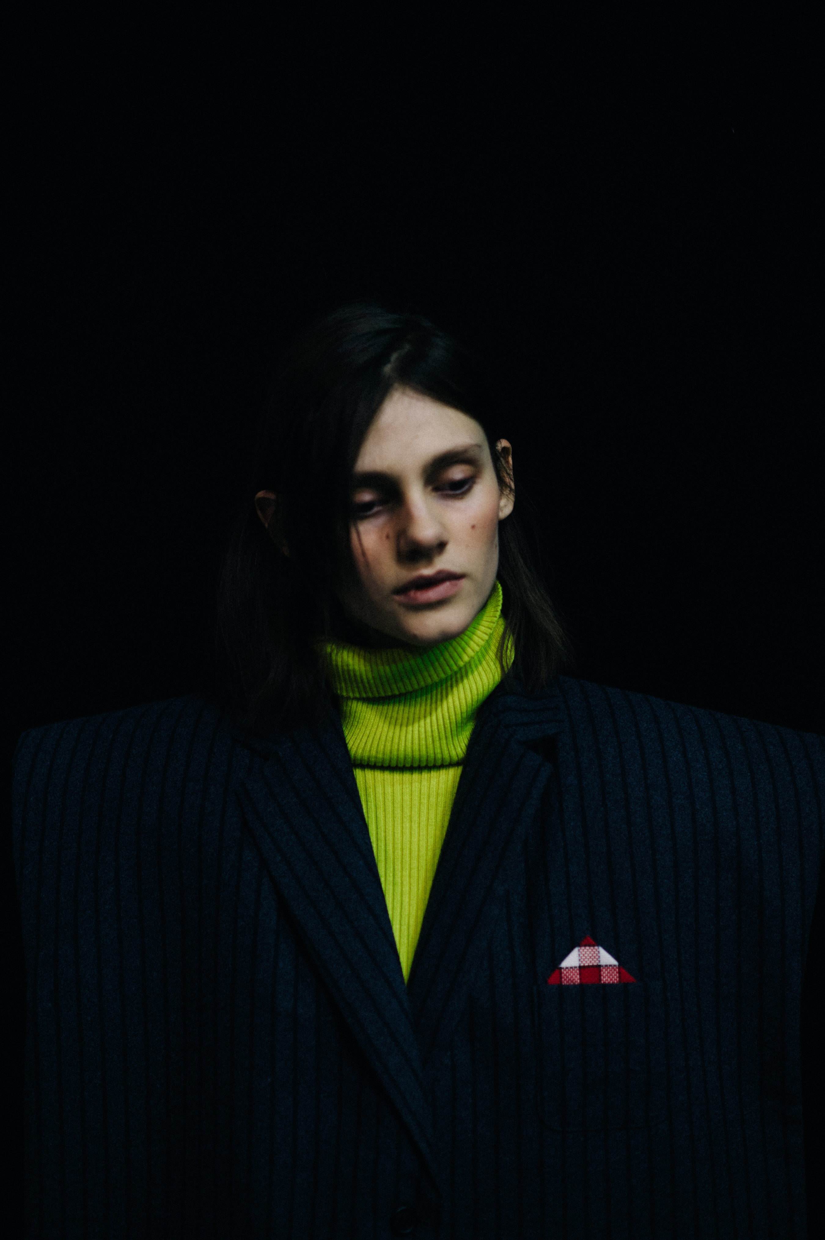 Ducth model wearing fluorescent turtleneck