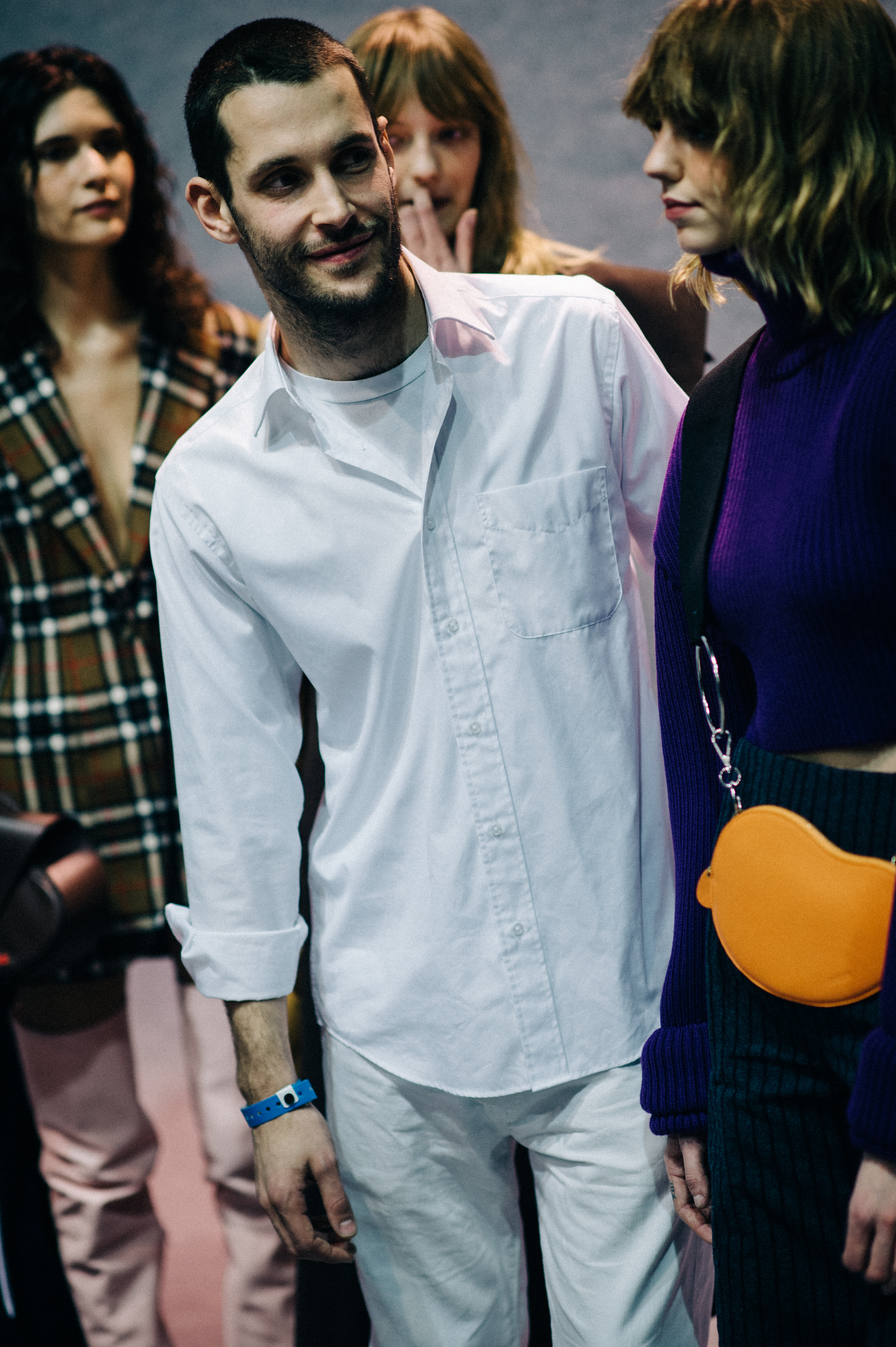 Designer stood next to models