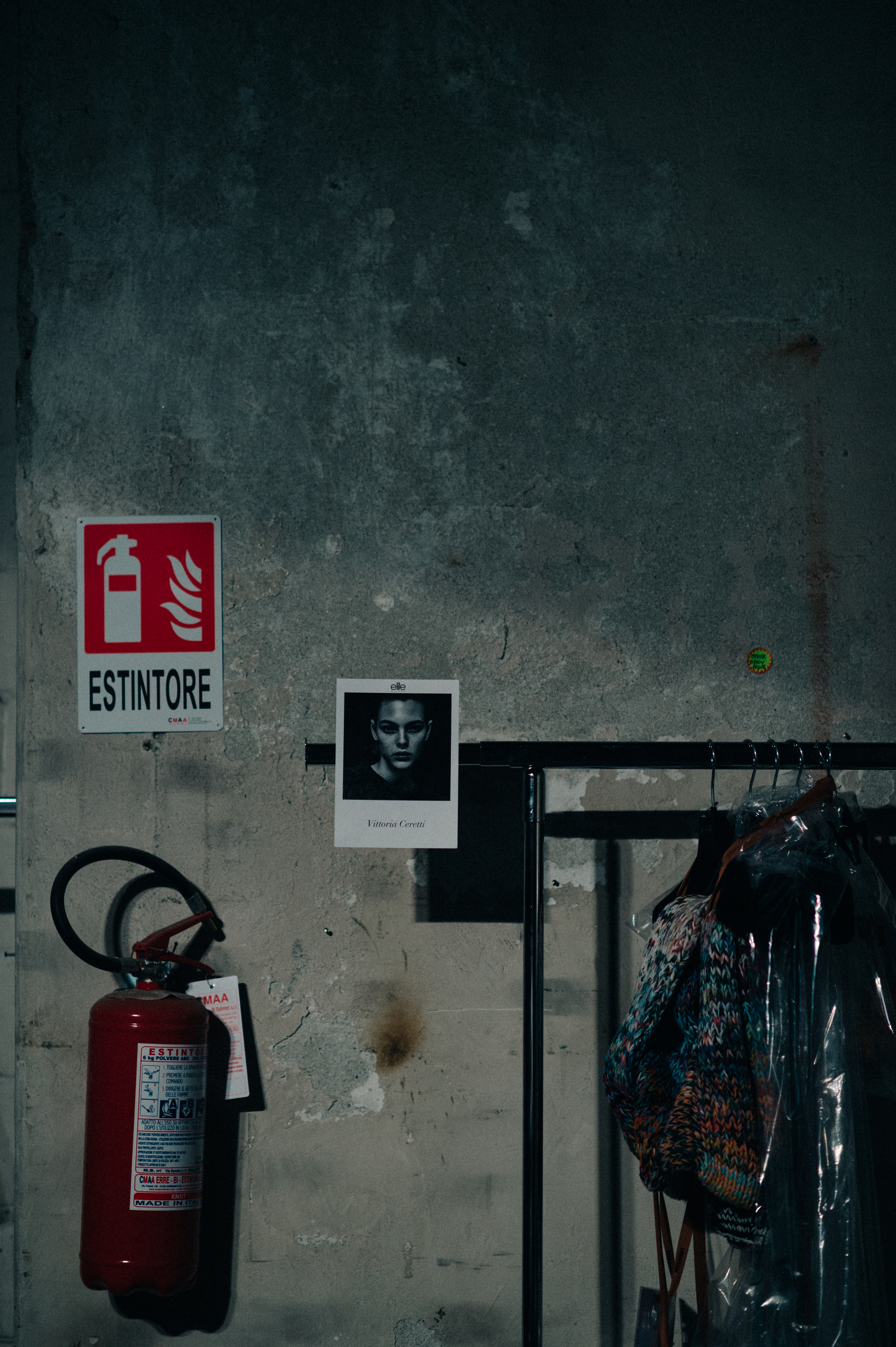 Rail with clothes and polaroid