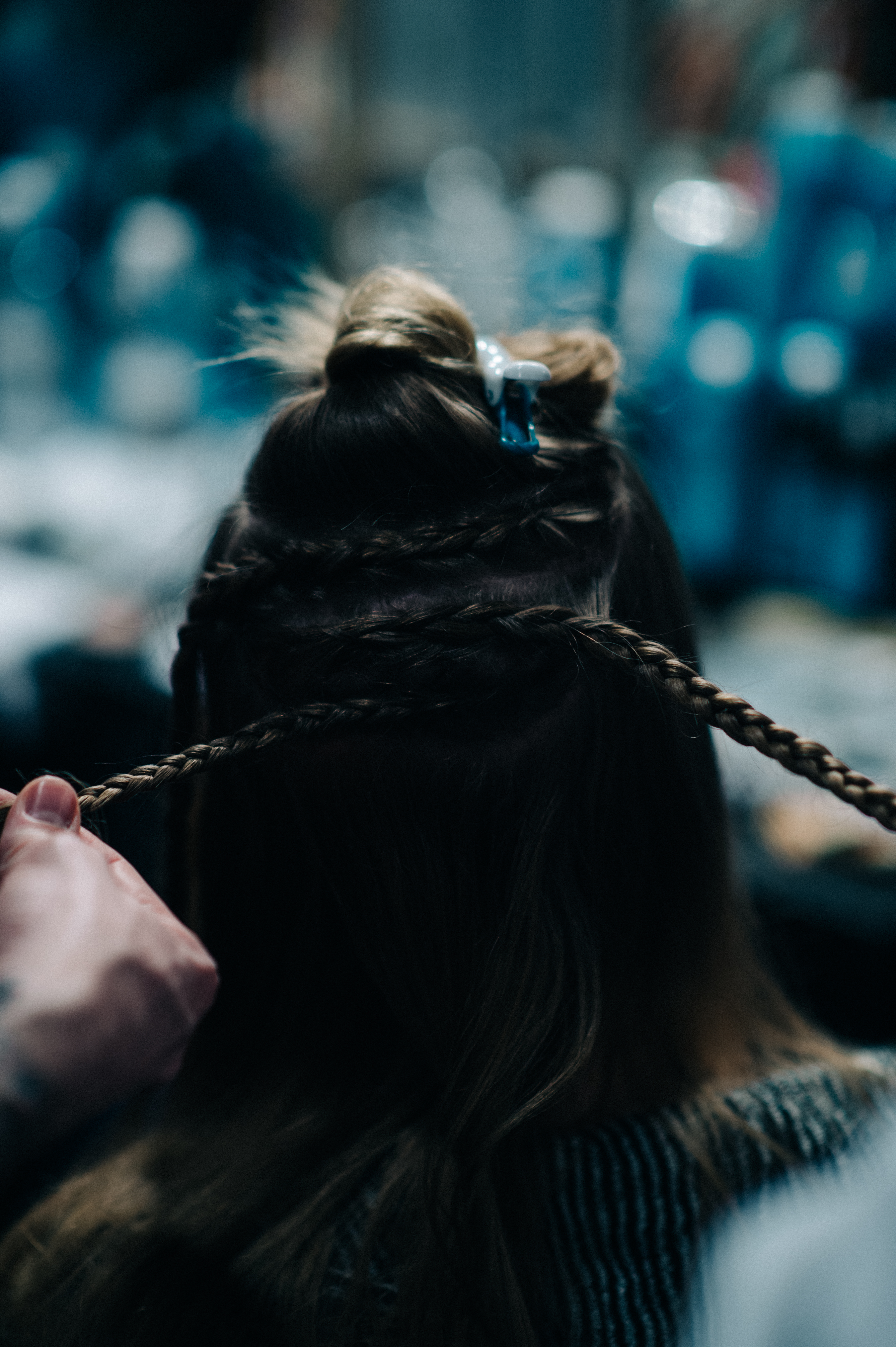 Model getting her hair braided