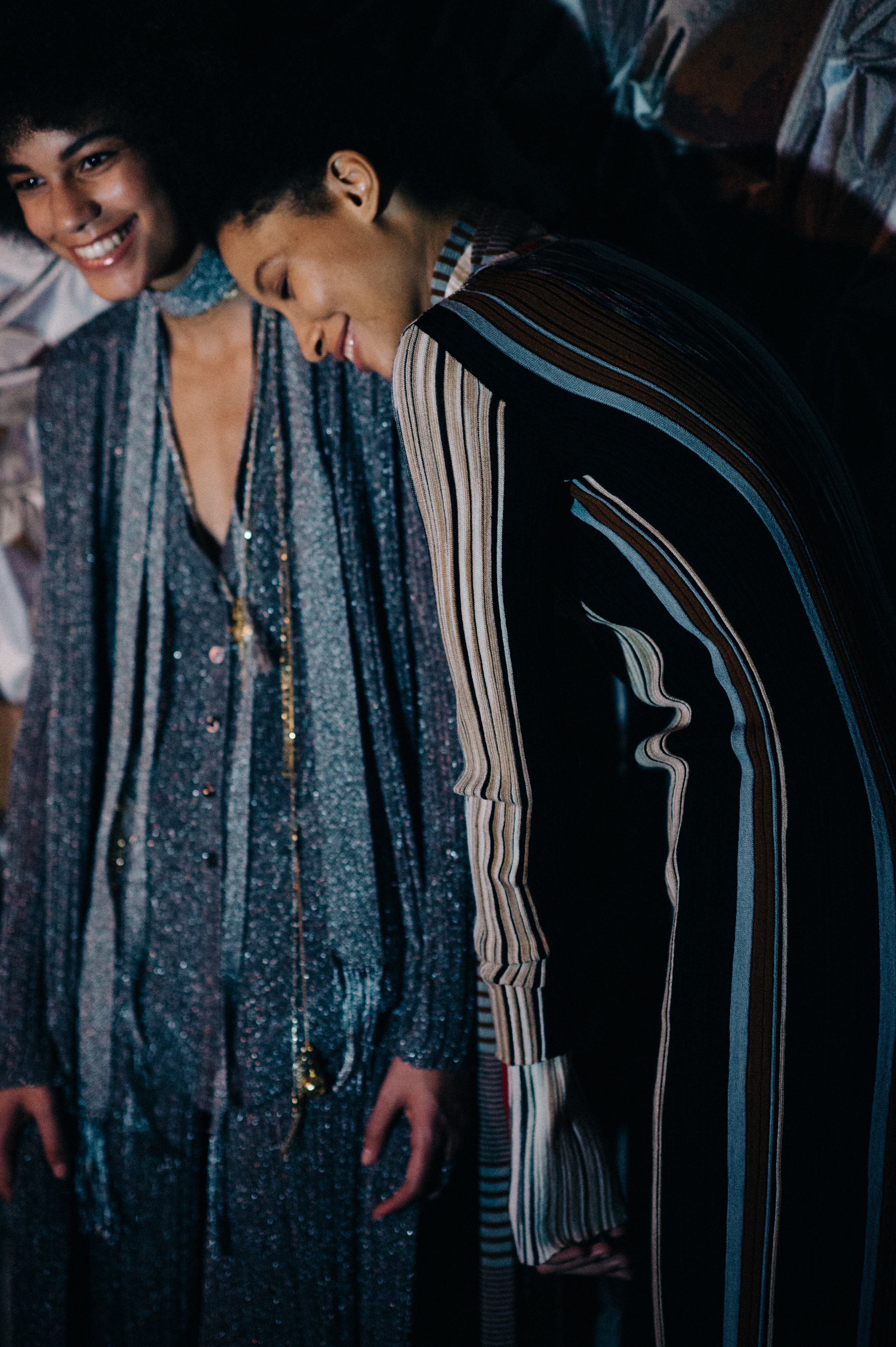 Two models wearing graphic outfits