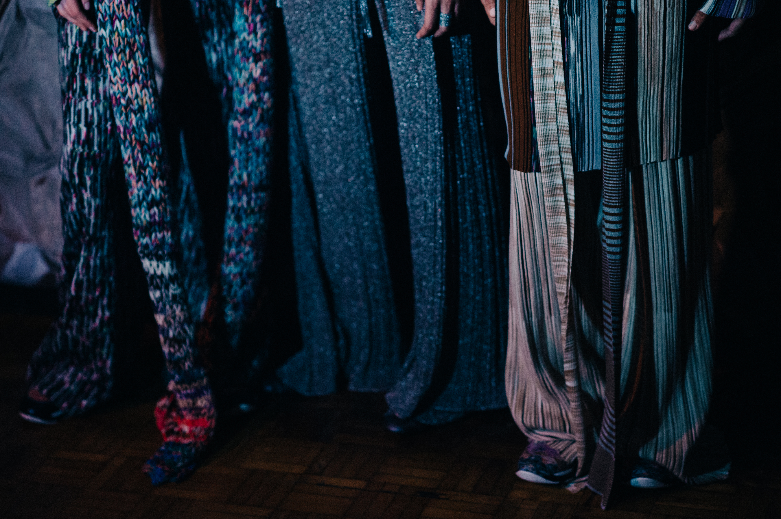 Detail shot of models wearing graphic clothes