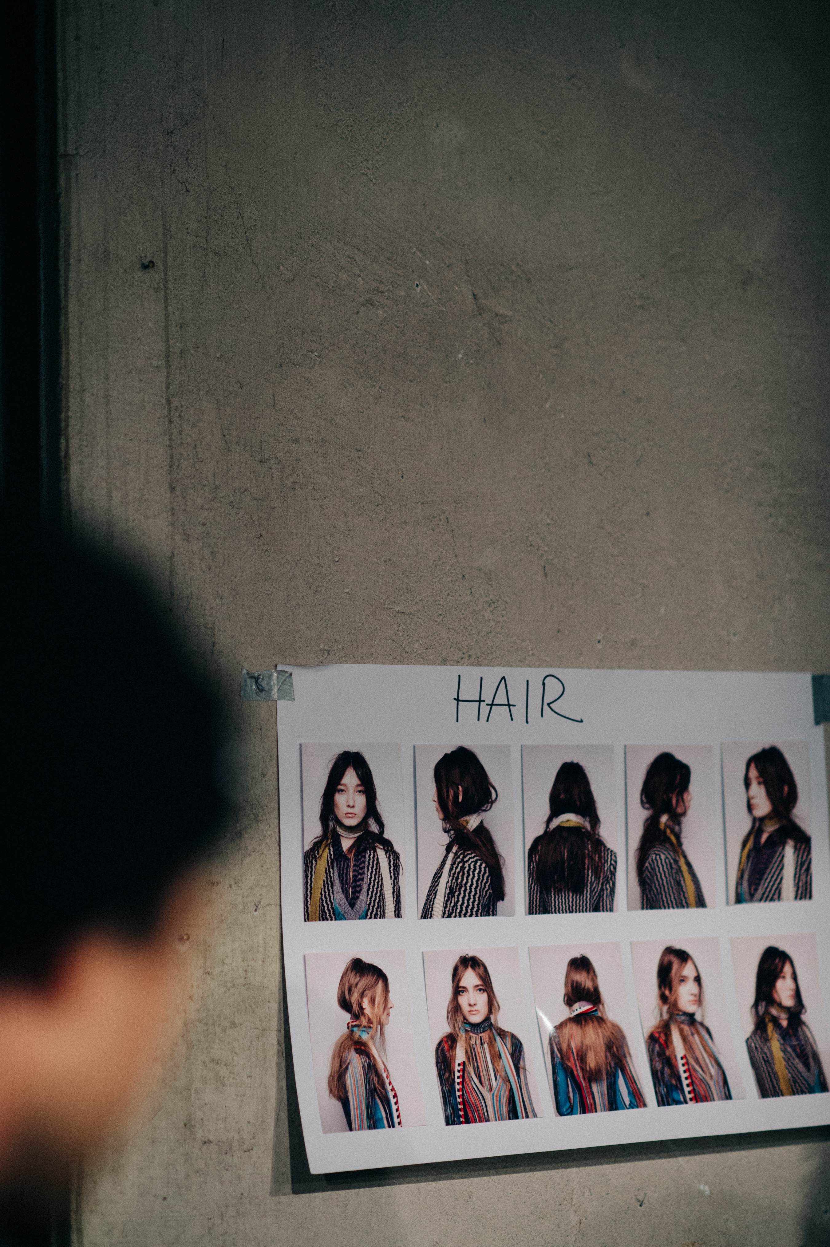 Board with model polaroids hair reference