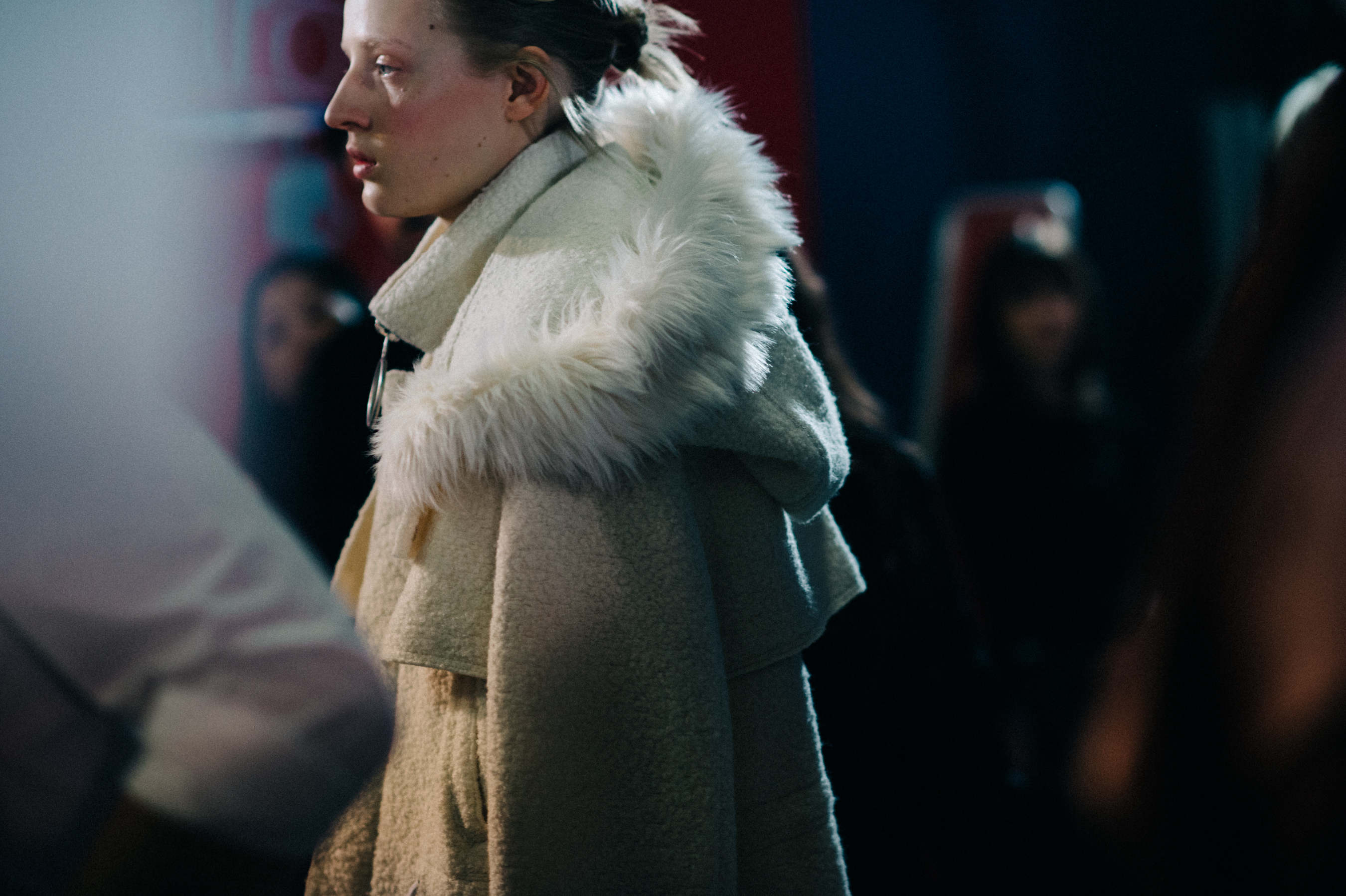 Dutch model wearing white coat