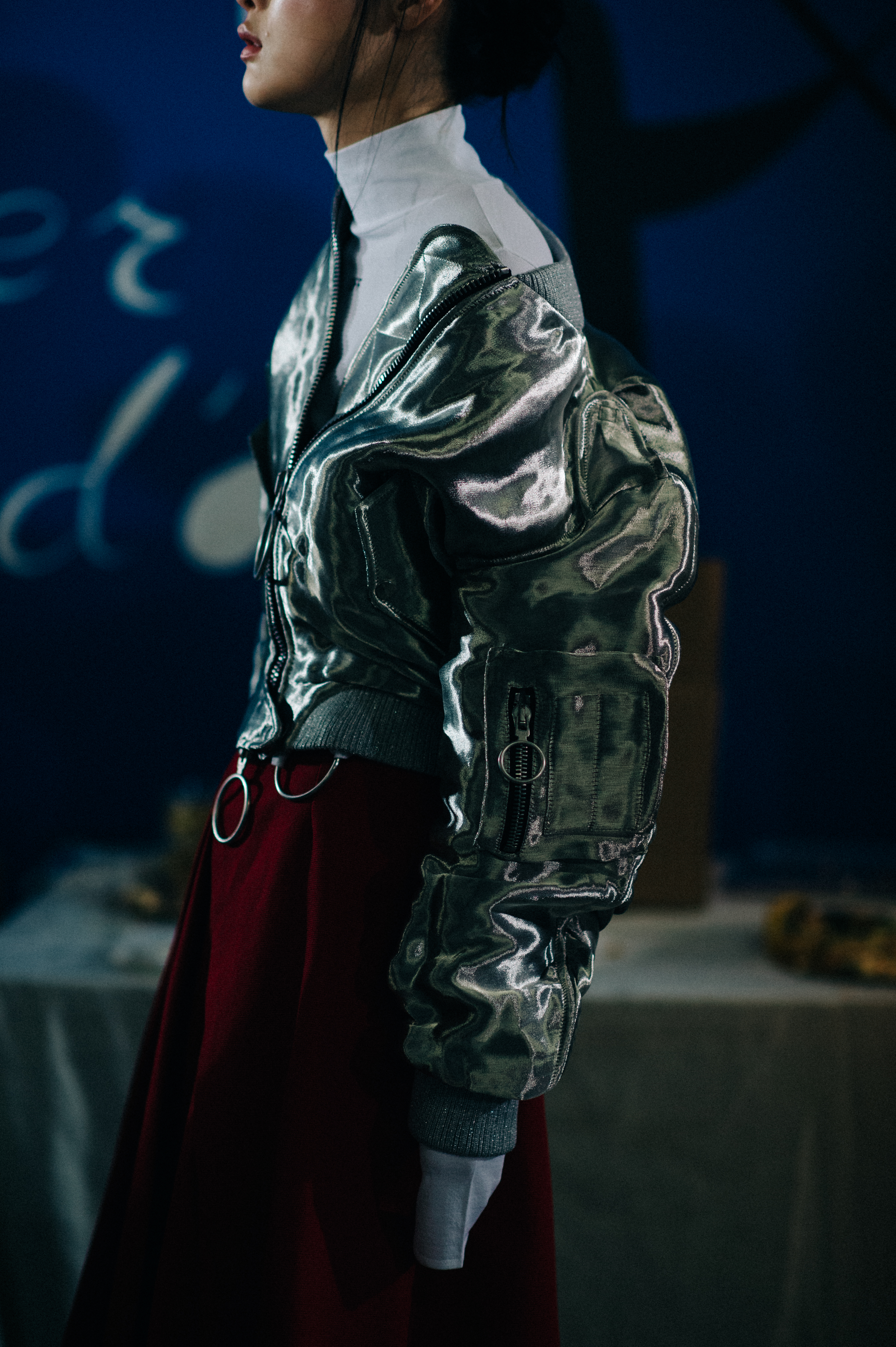 Model wearing silver oversized jacket