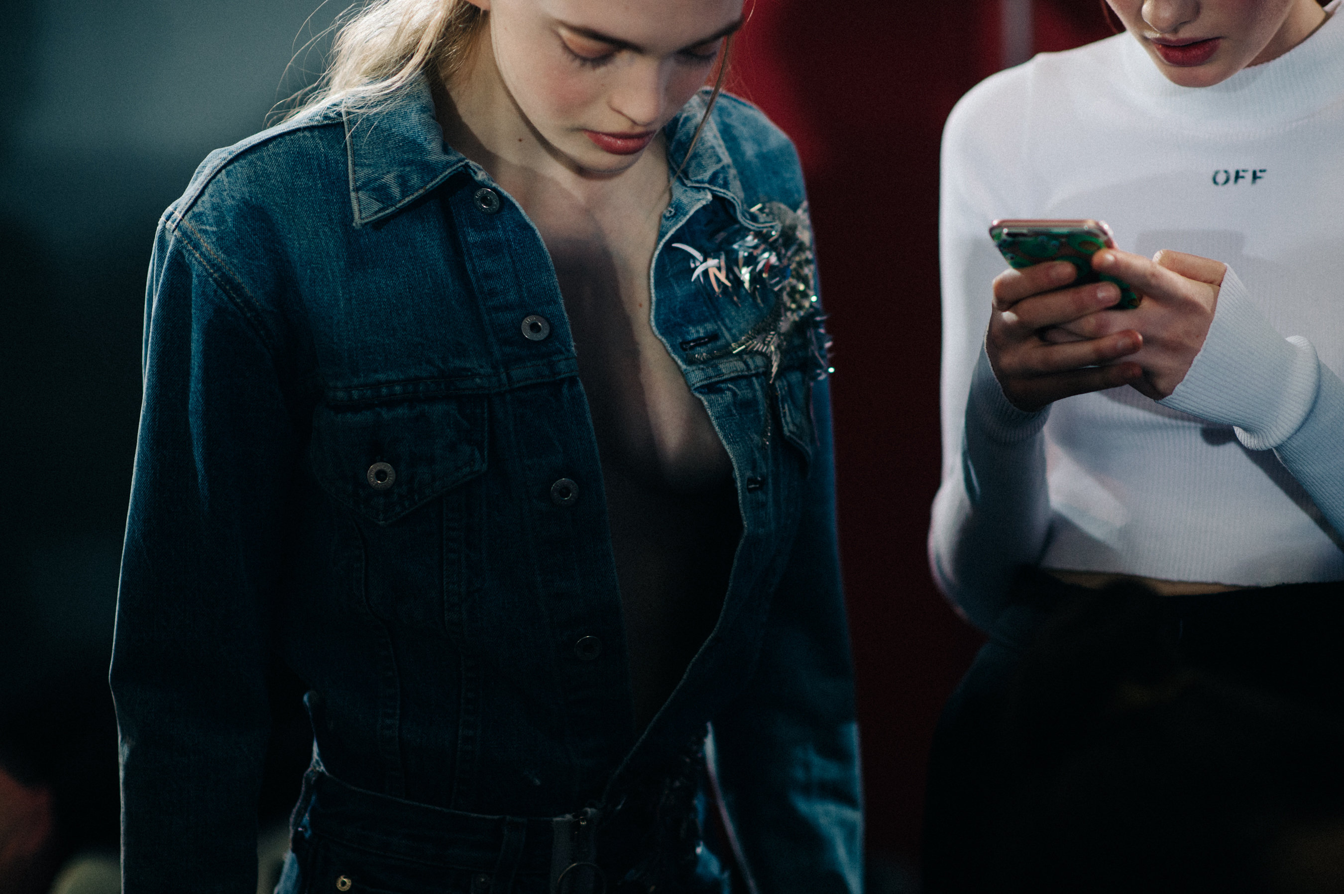 Two models wearing denim jacket