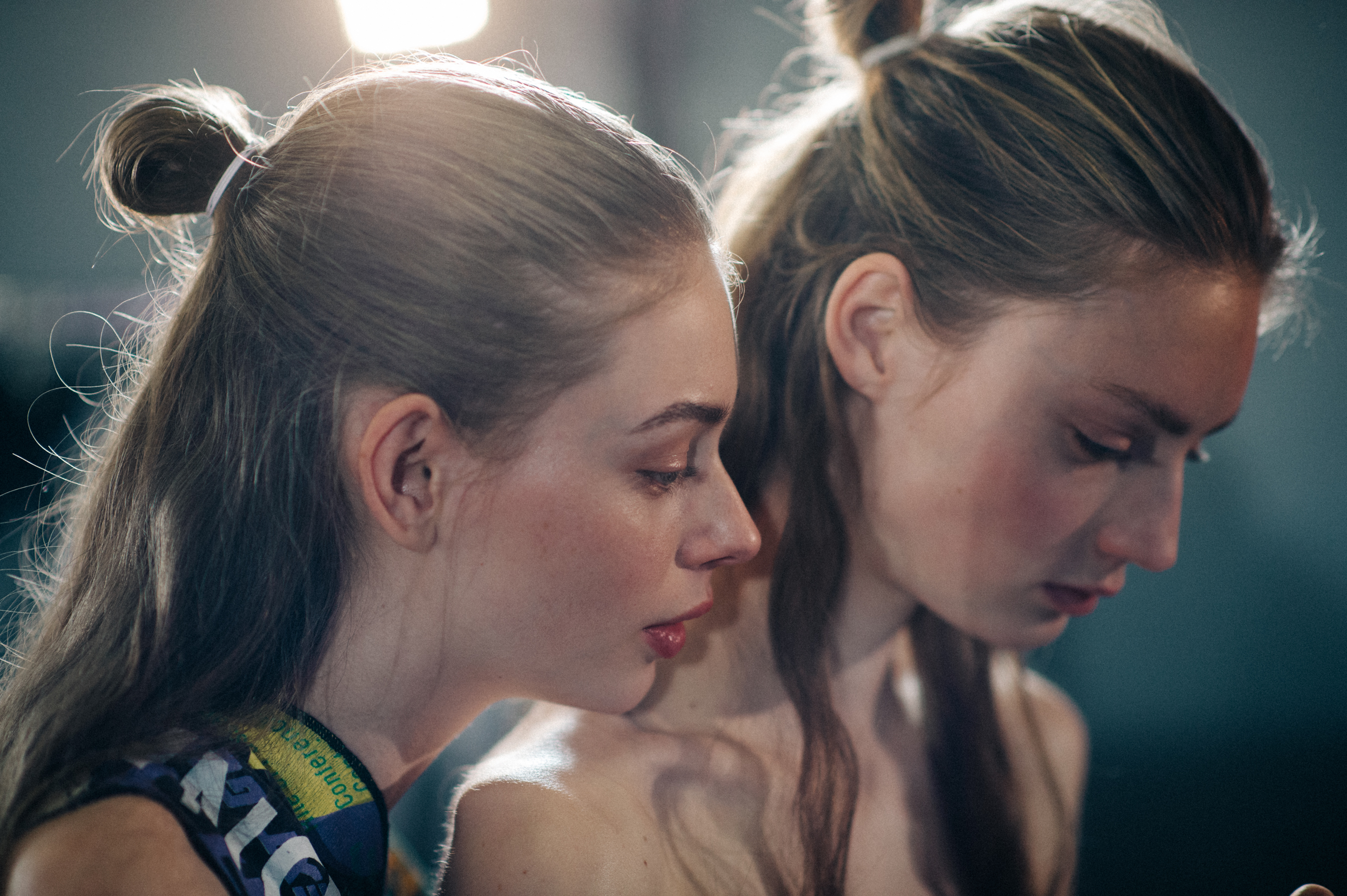 Two models with hair tied