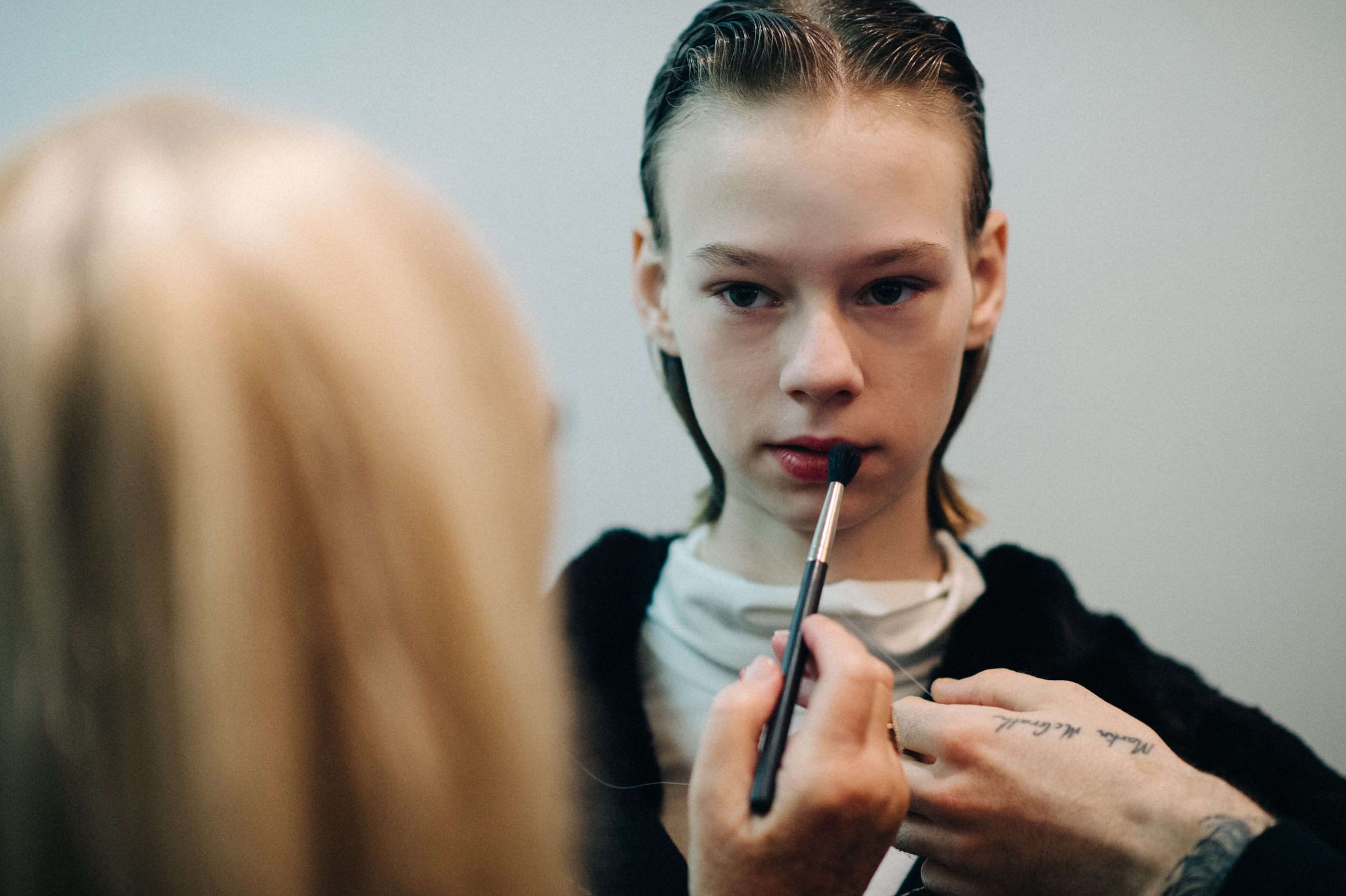 Model getting make up done