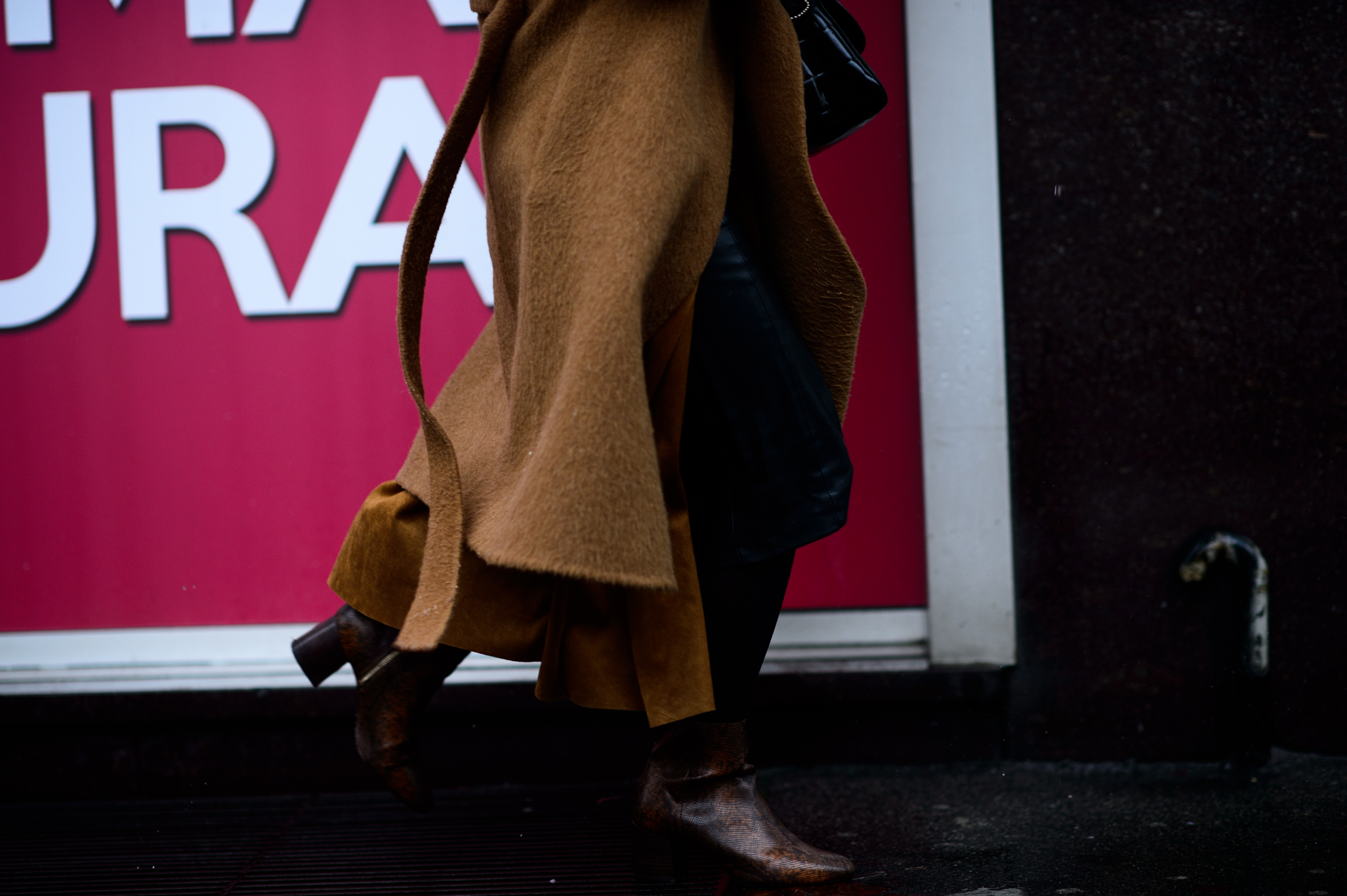 Close up of beige coat and boots