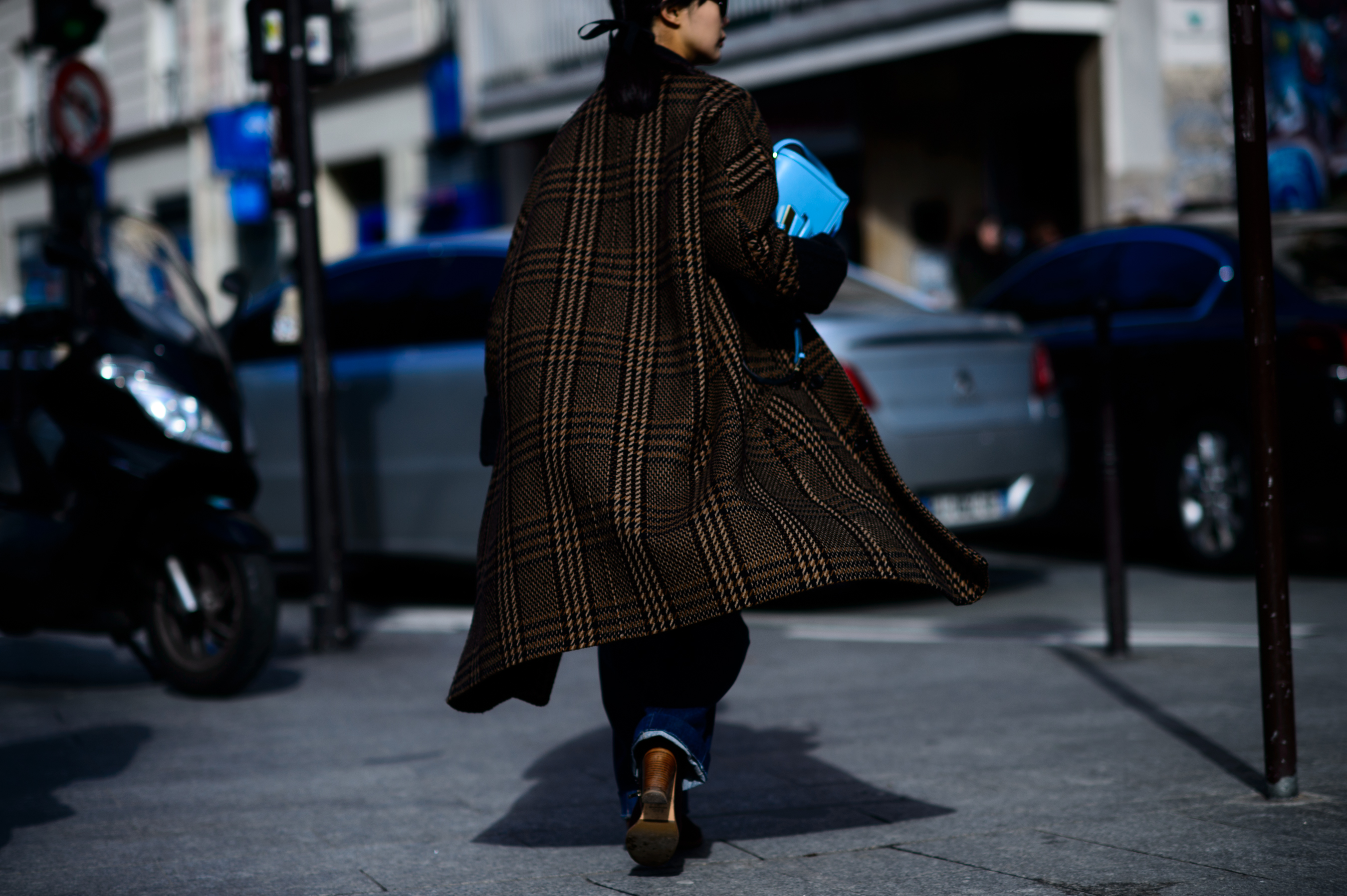 Woman wearing plaid wool overcoat