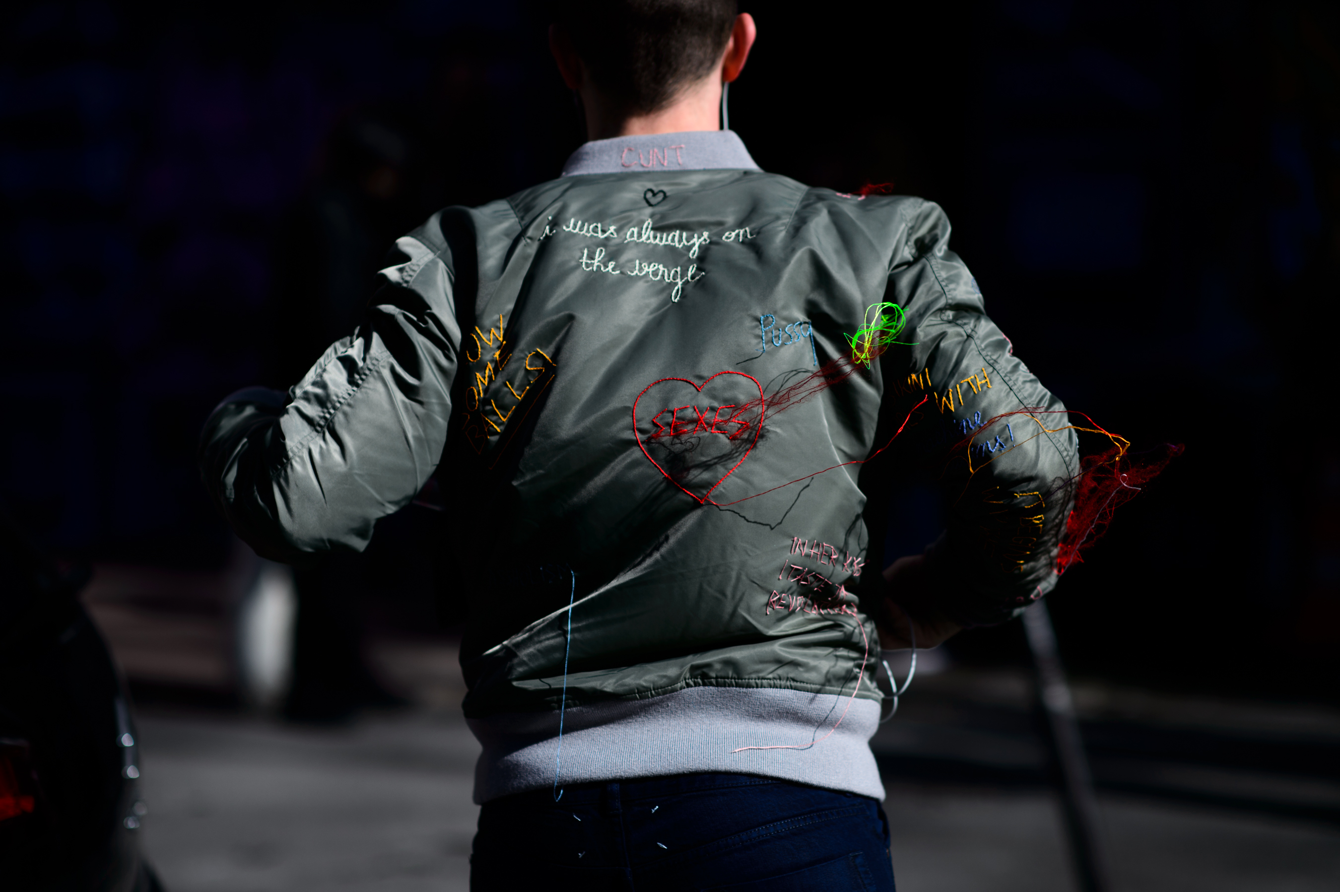 Man wearing embroidered bomber jacket