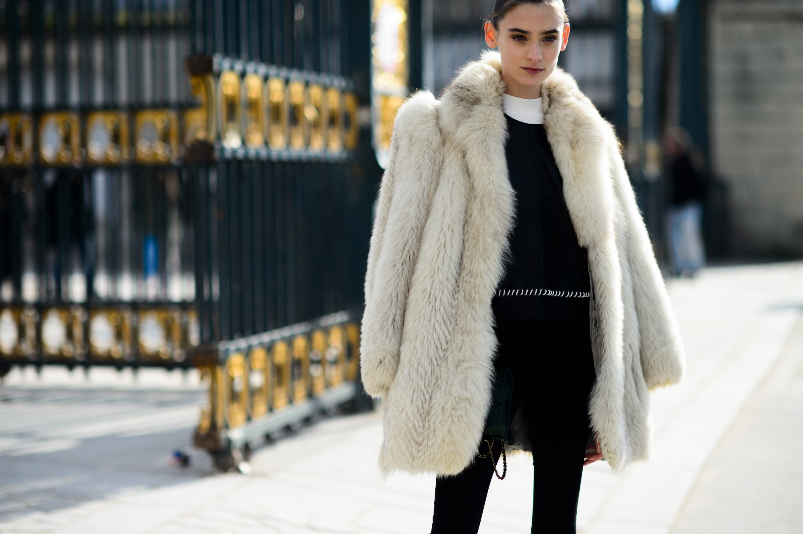 Model wearing white fur coat