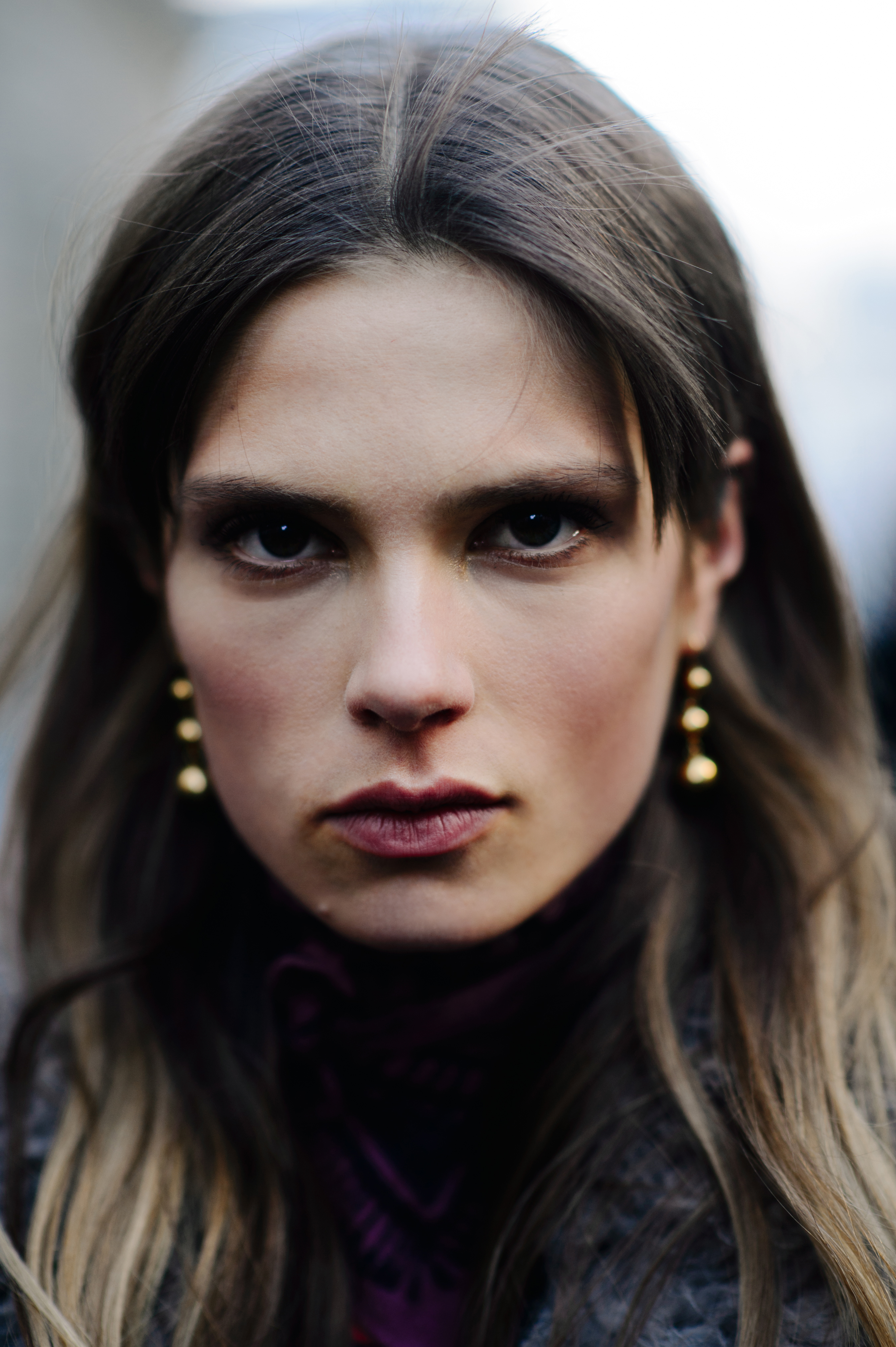 Portrait of Danish model with gold earrings