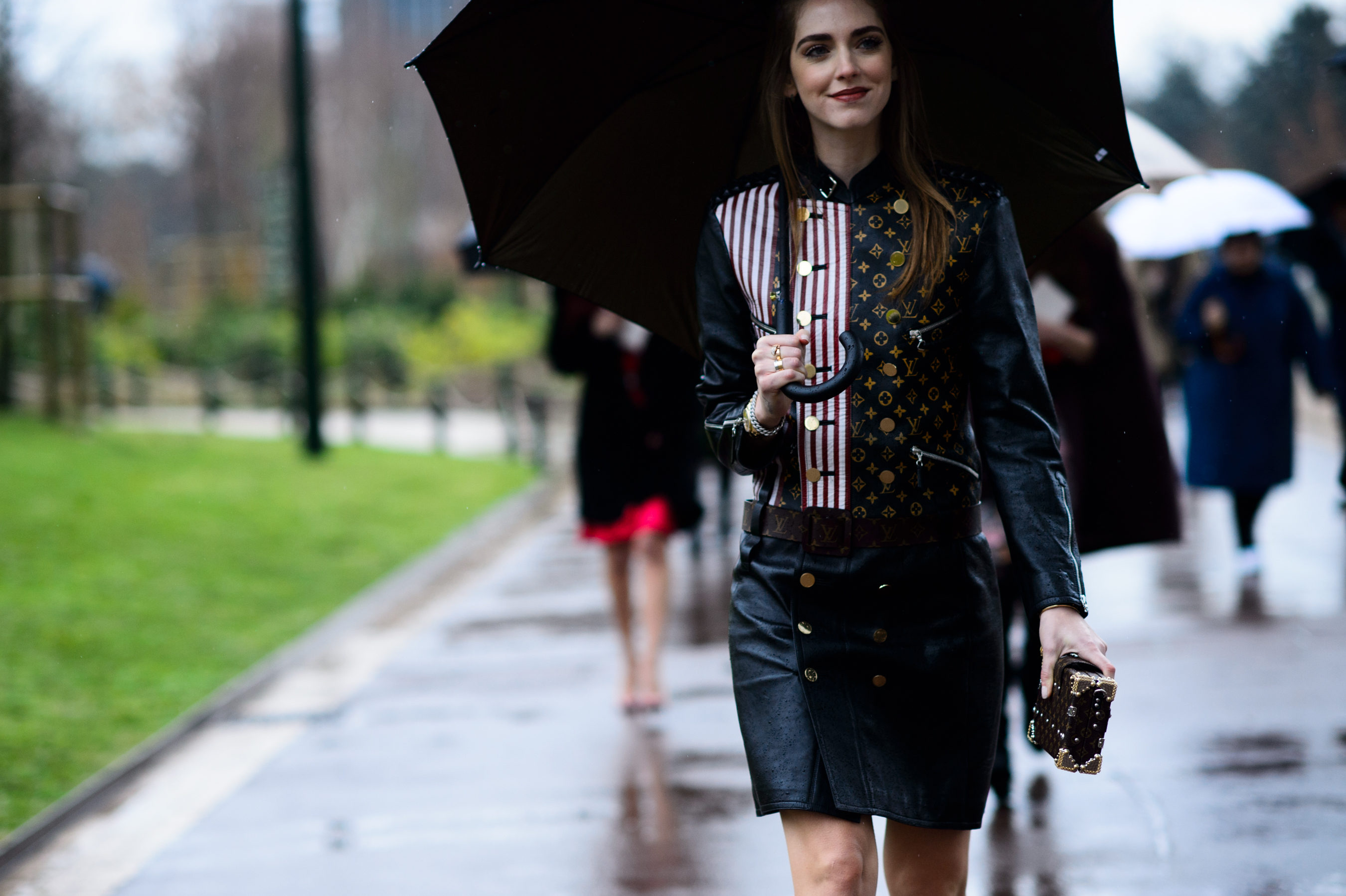Blogger wearing gold and black jacket with matching skirt
