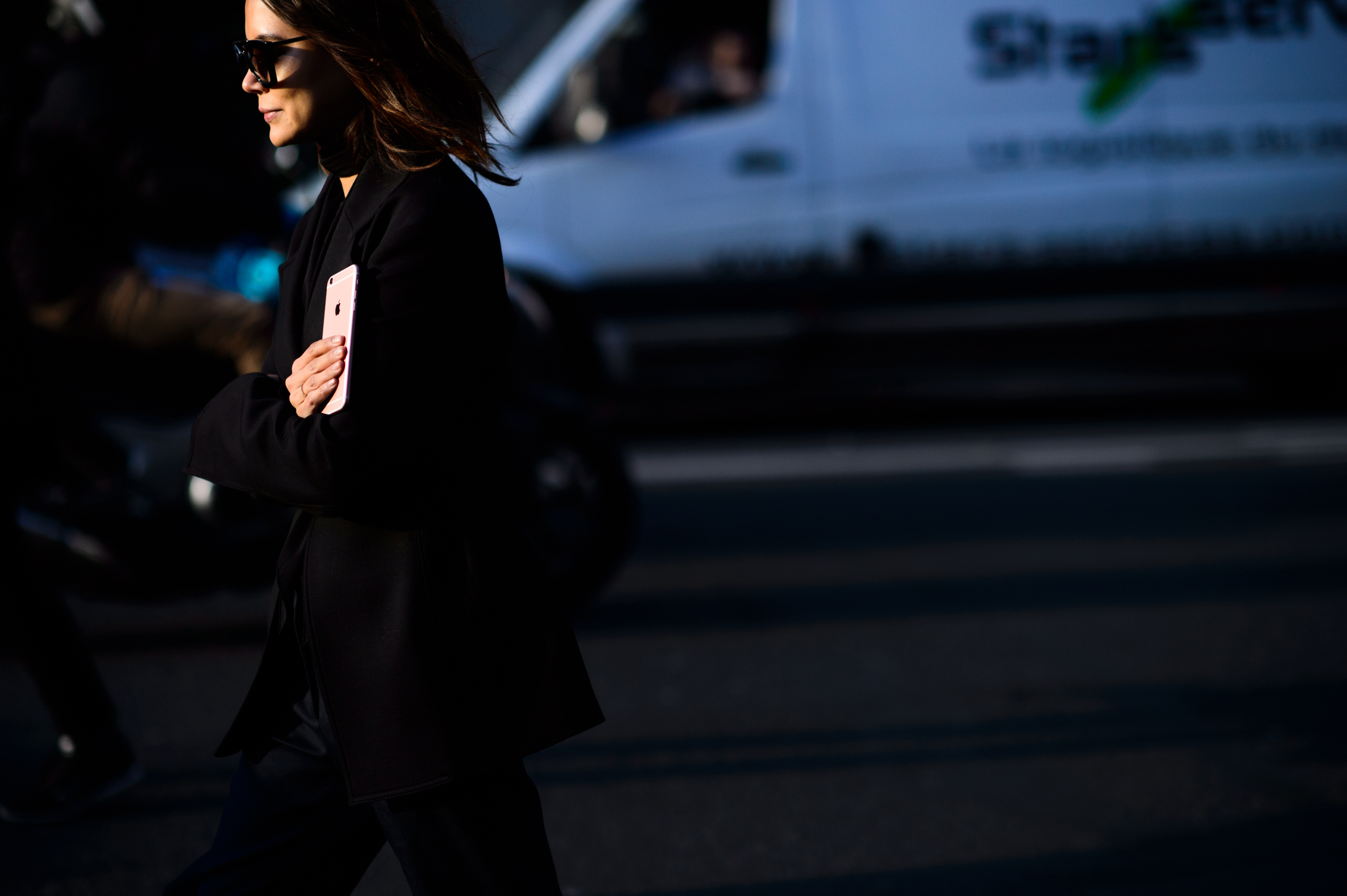 Woman walks into bright sunlight