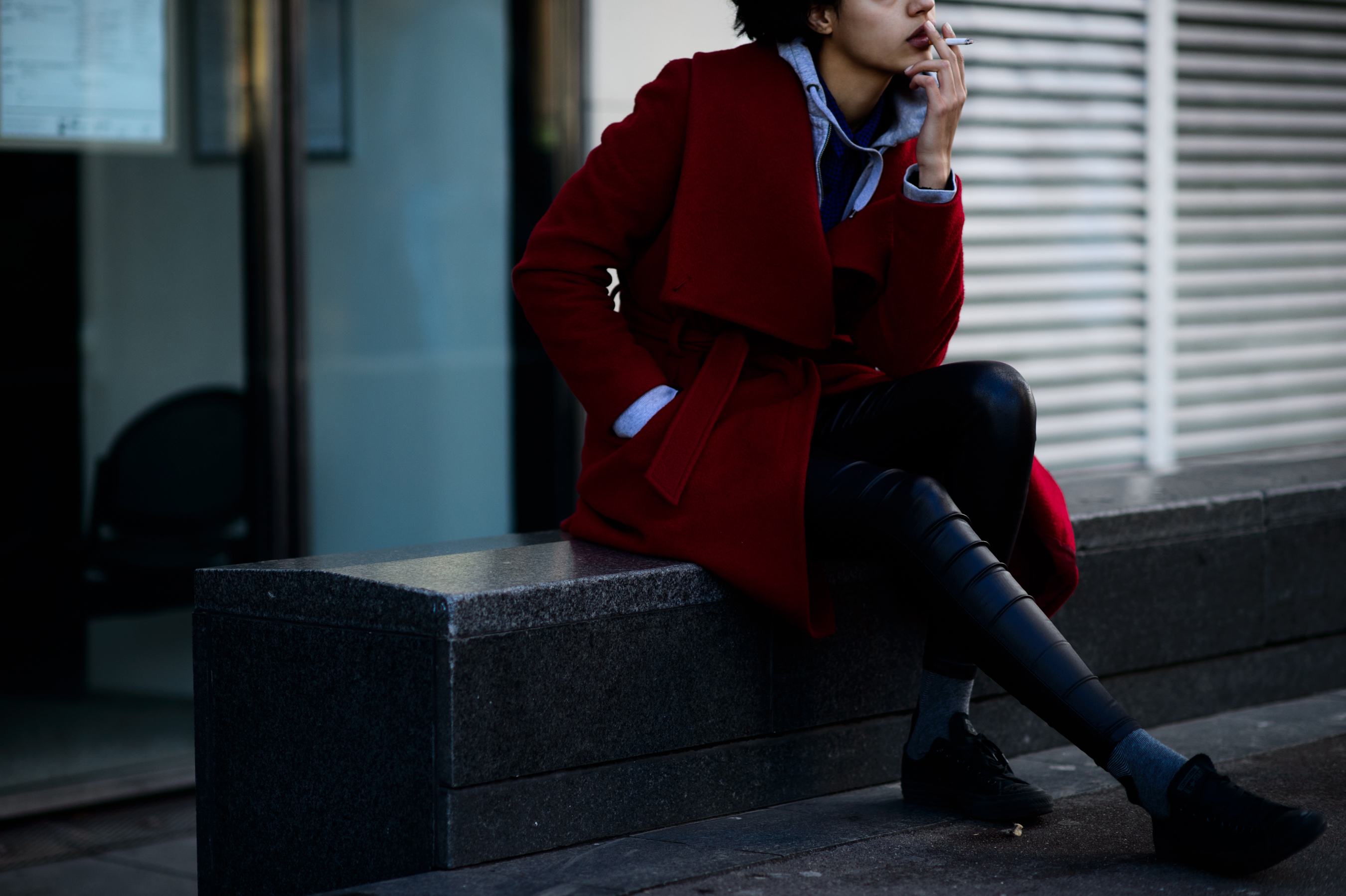 Dutch model smoking wearing red coat