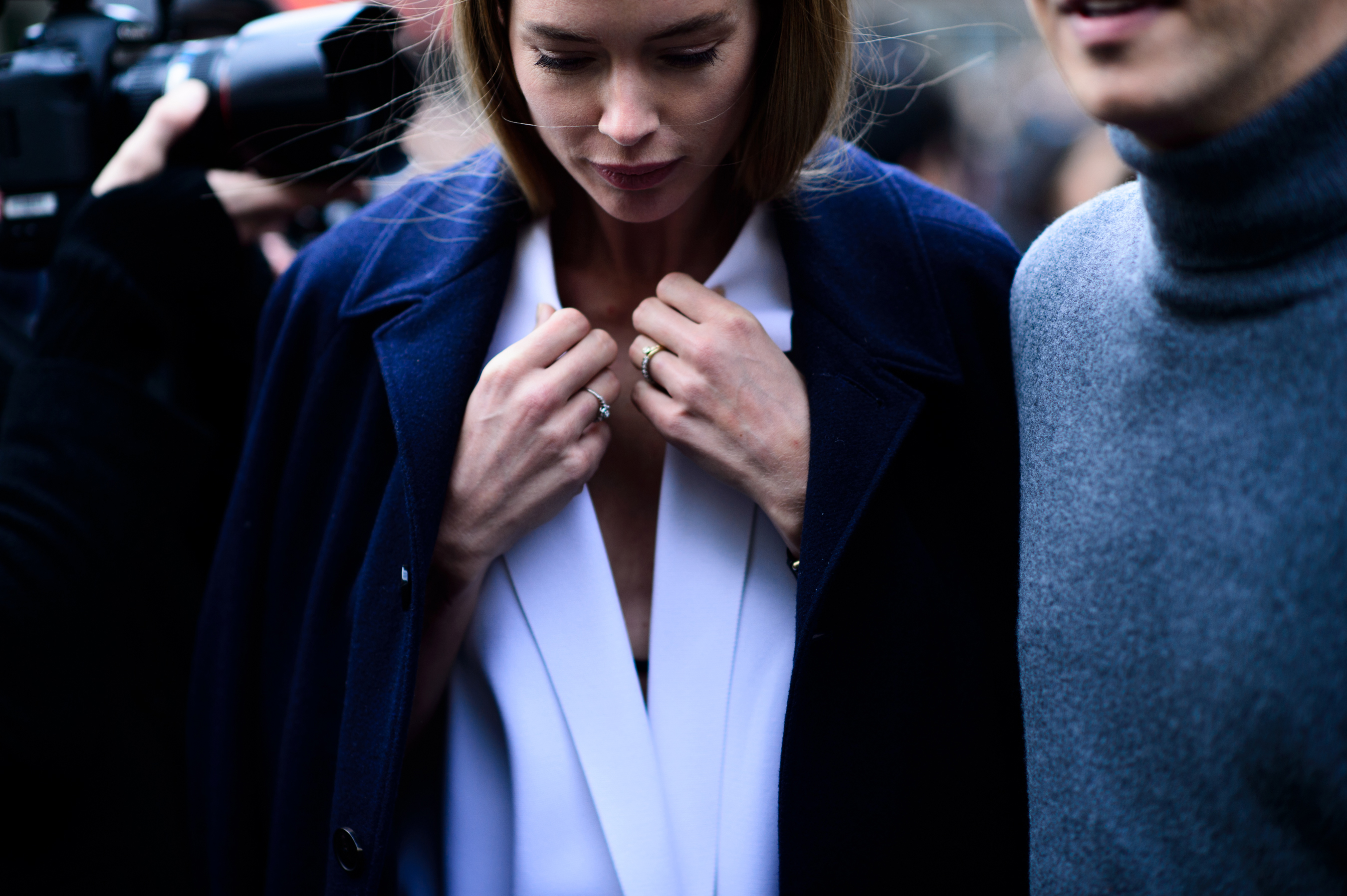 Closeup of Dutch model with hands clutched to collar