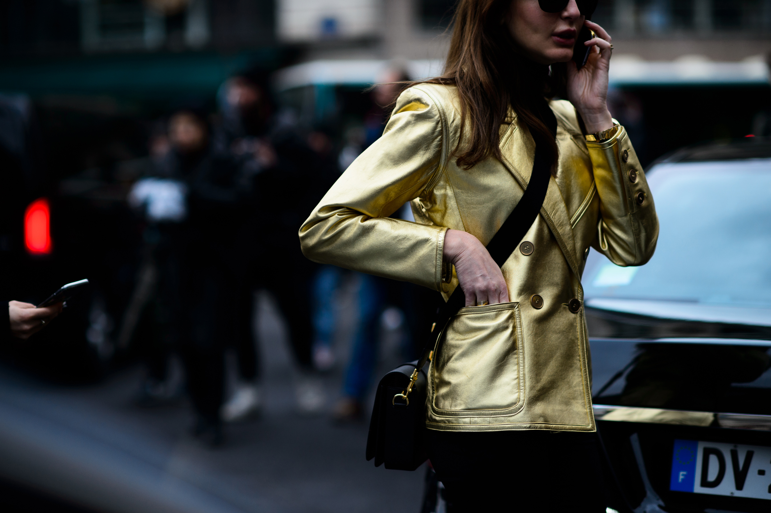 Woman in shiny golden jacket