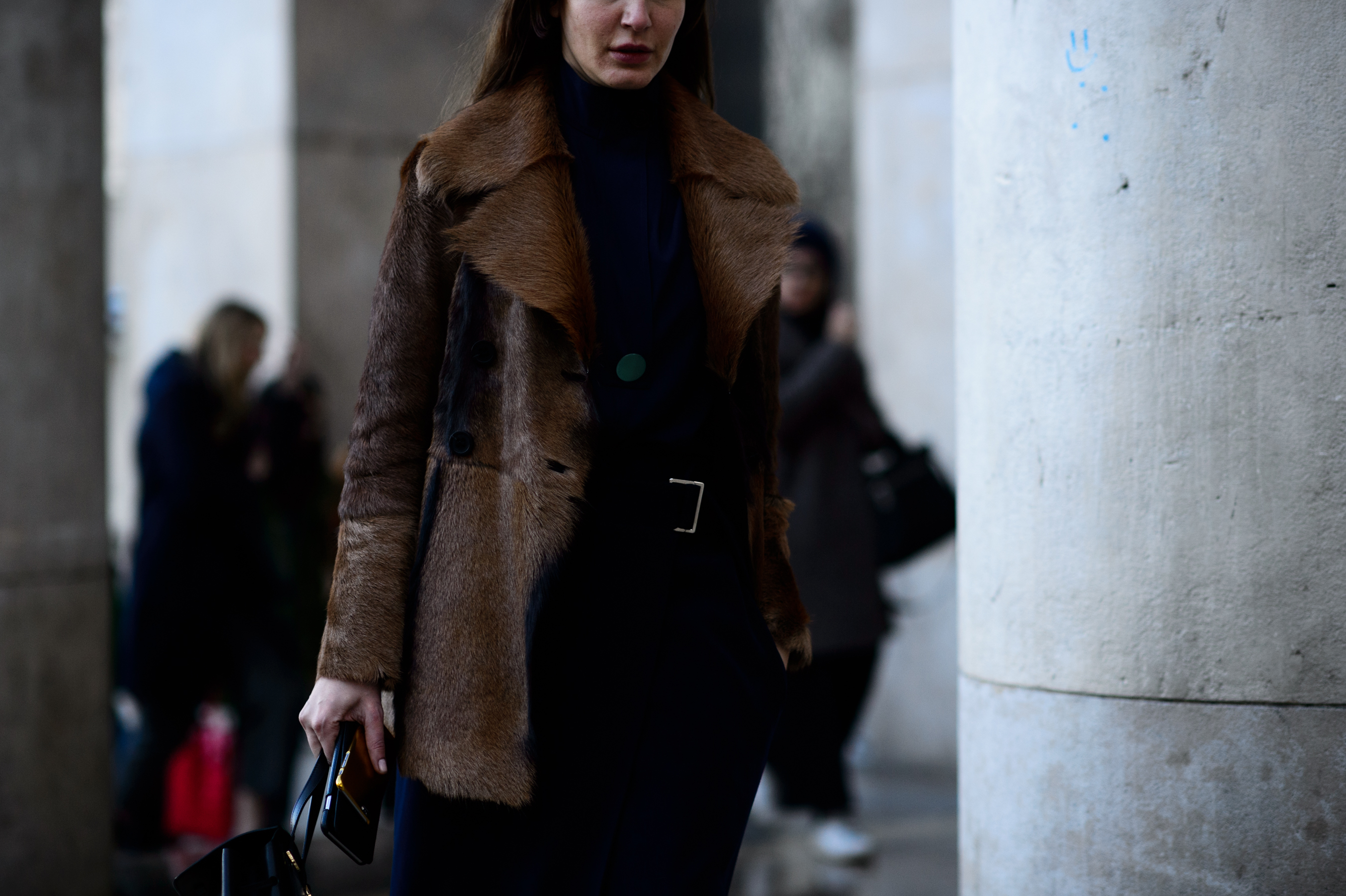 Woman wearing brown fur jacket