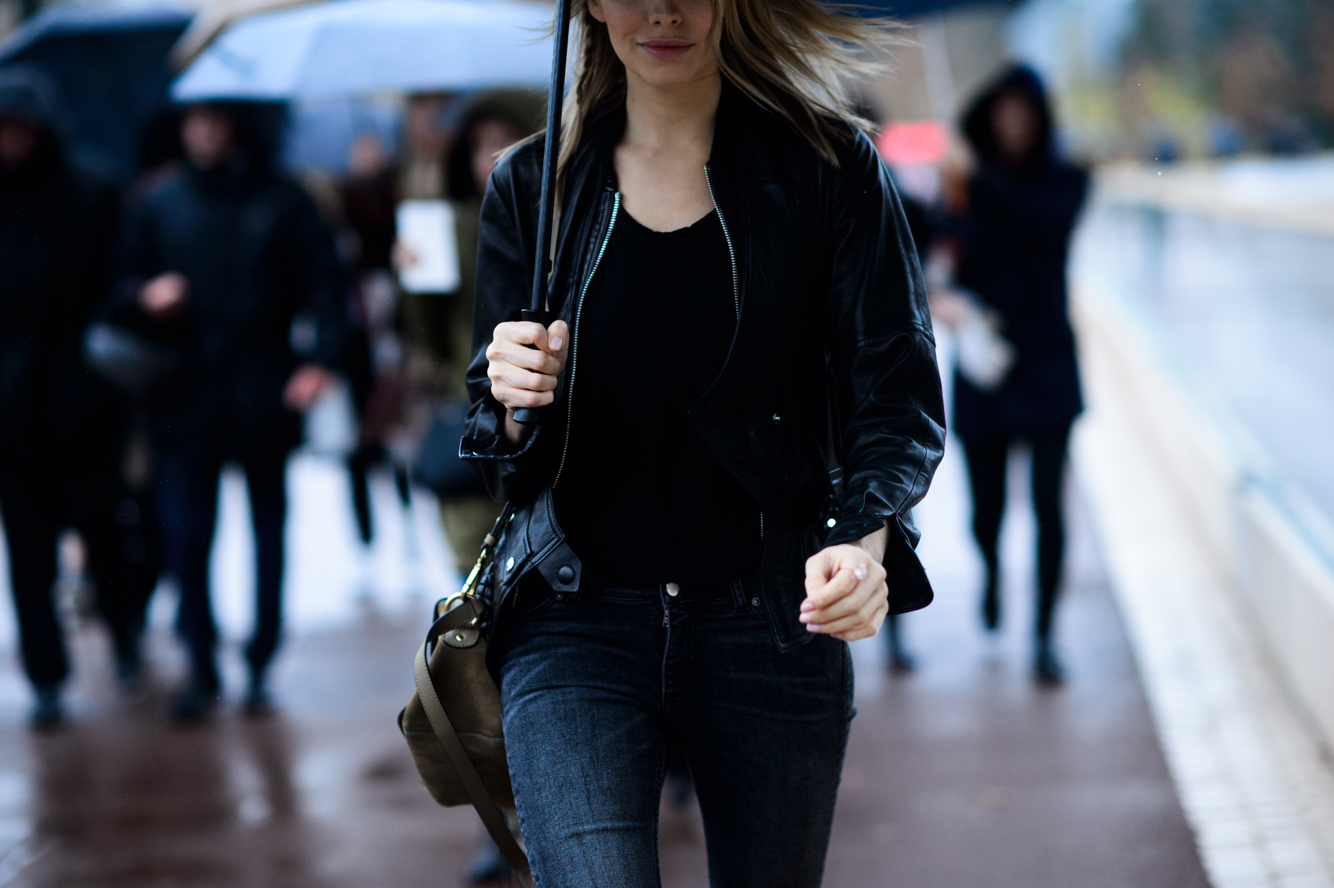 Russian woman walking in all black outfit